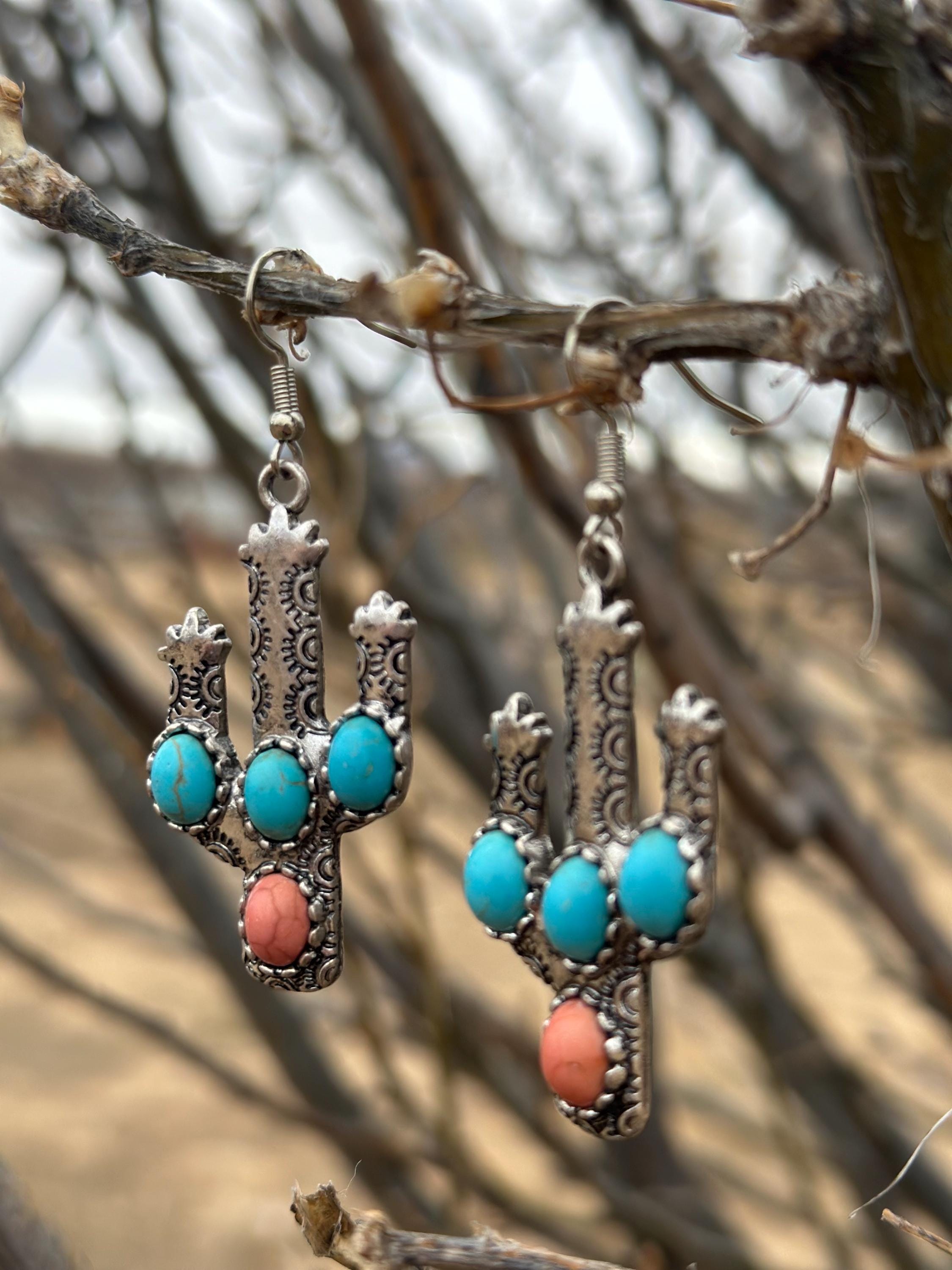 Western Cactus Earrings, featuring turquoise and coral stone accents. Lightweight and comfy these Cactus Earrings are perfect for daily wear or special occasions. Shop Razels—FREE shipping on $35+ orders! 🌵✨