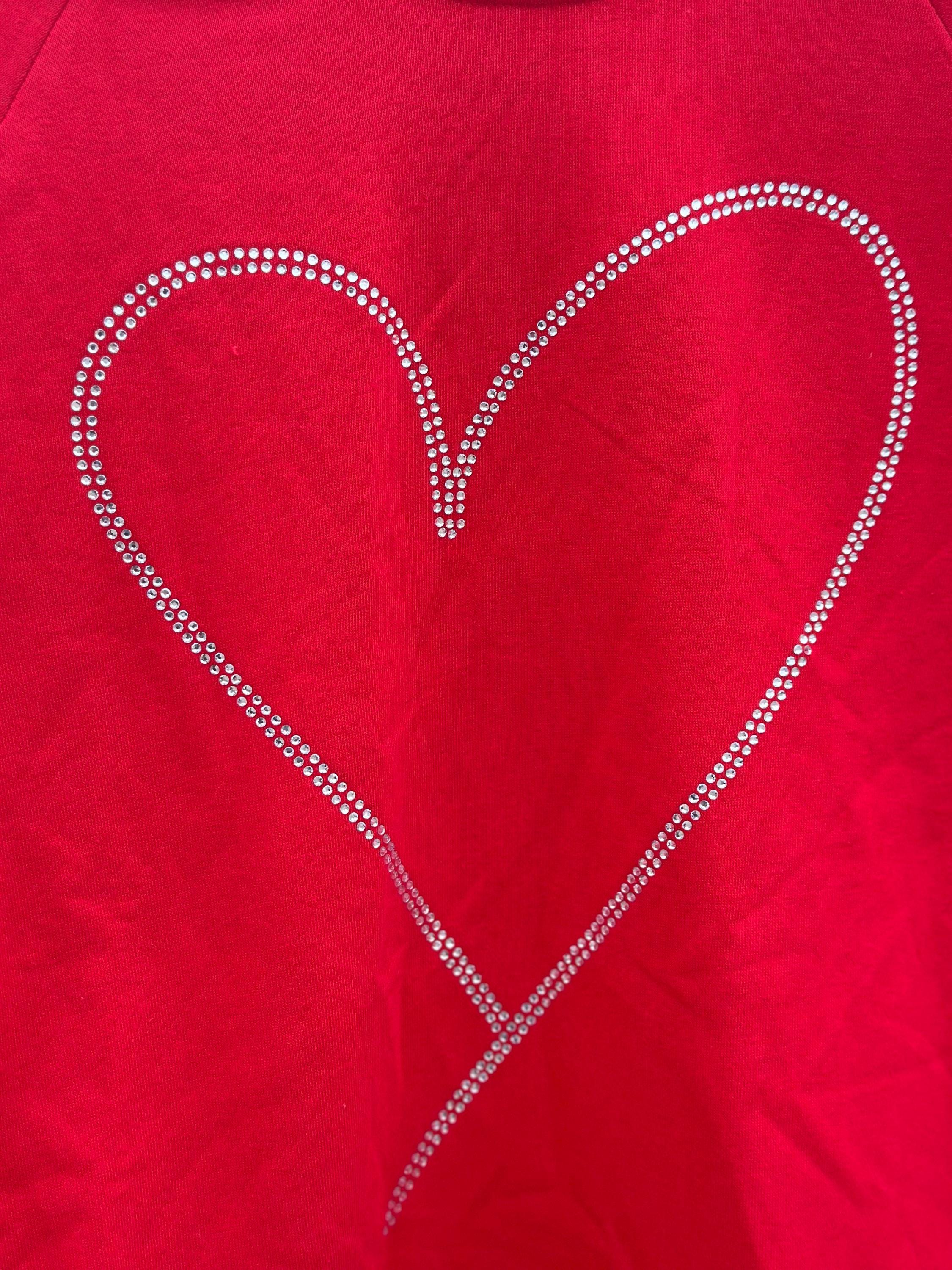 Add sparkle to your style with the Rhinestone Heart Shaped Sweatshirt! Featuring a glittering heart design, relaxed neckline, and cozy long sleeves, it's perfect for all-day comfort. Ships for FREE—shop Razels now!