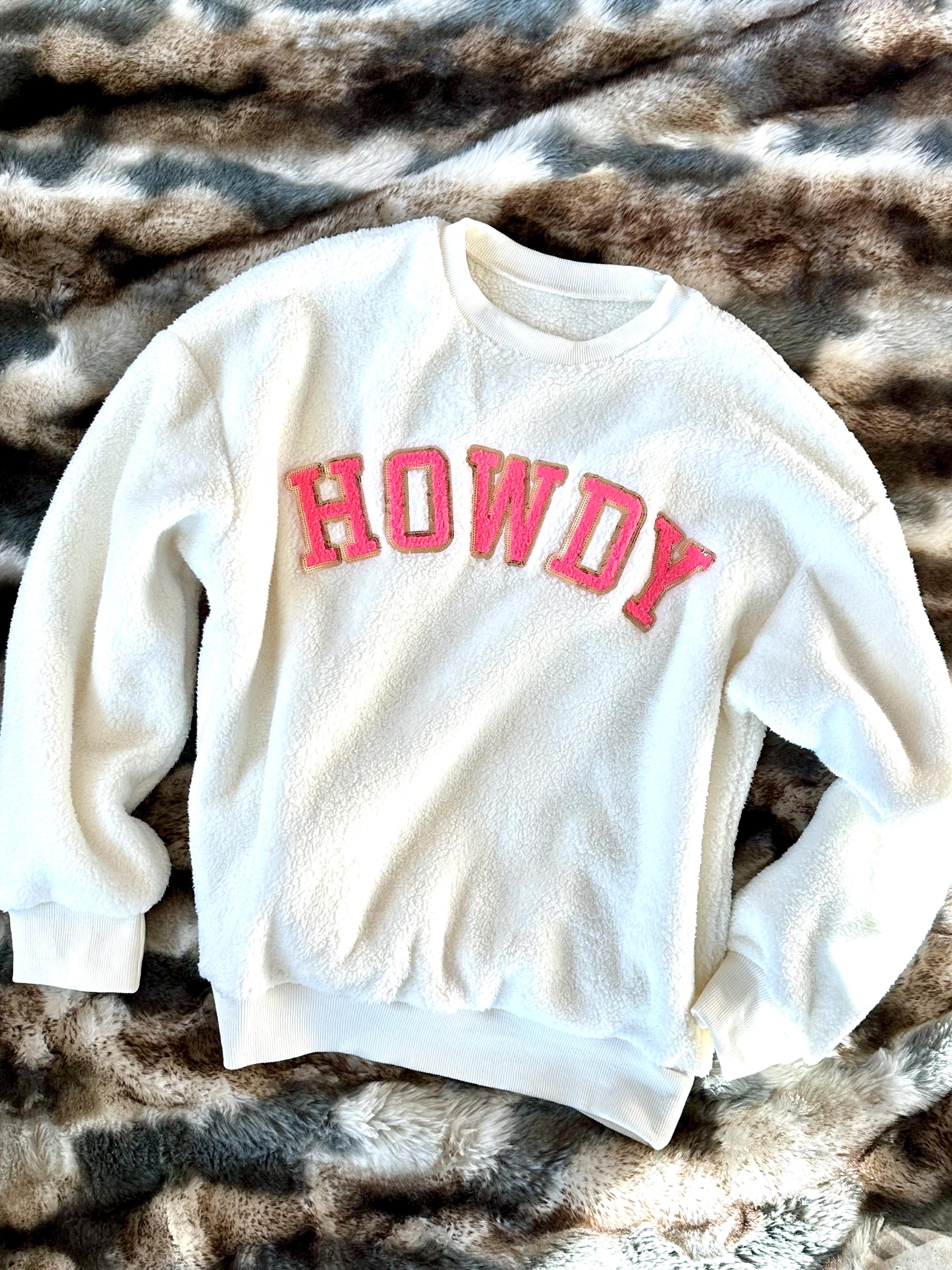 The coziest, softest, and fuzziest sweatshirt for cowgirls is hereâmeet the Pink Howdy Sweatshirt!
Stay warm and stylish with its ultra-soft sherpa fabric that brings ultimate comfort and it's bold hot pink "HOWDY" letter patch