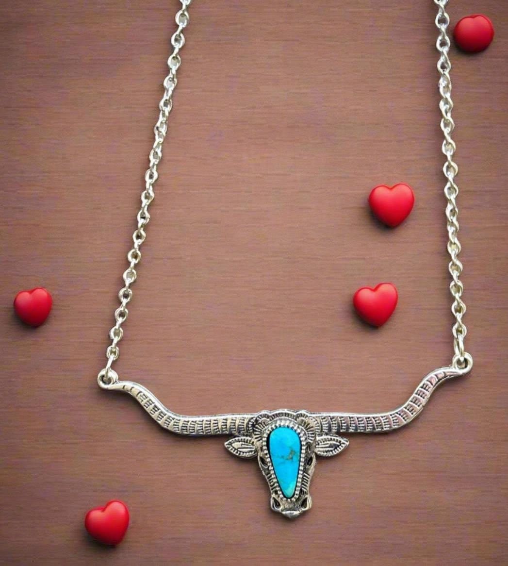 Bold and Beautiful: Split Chain Longhorn Necklace with Turquoise Stone. Embrace a bold, Western style with our stunning Split Chain Longhorn Necklaceādesigned for those who truly & grab life by the horns. Ships FREE with $35+ purchase