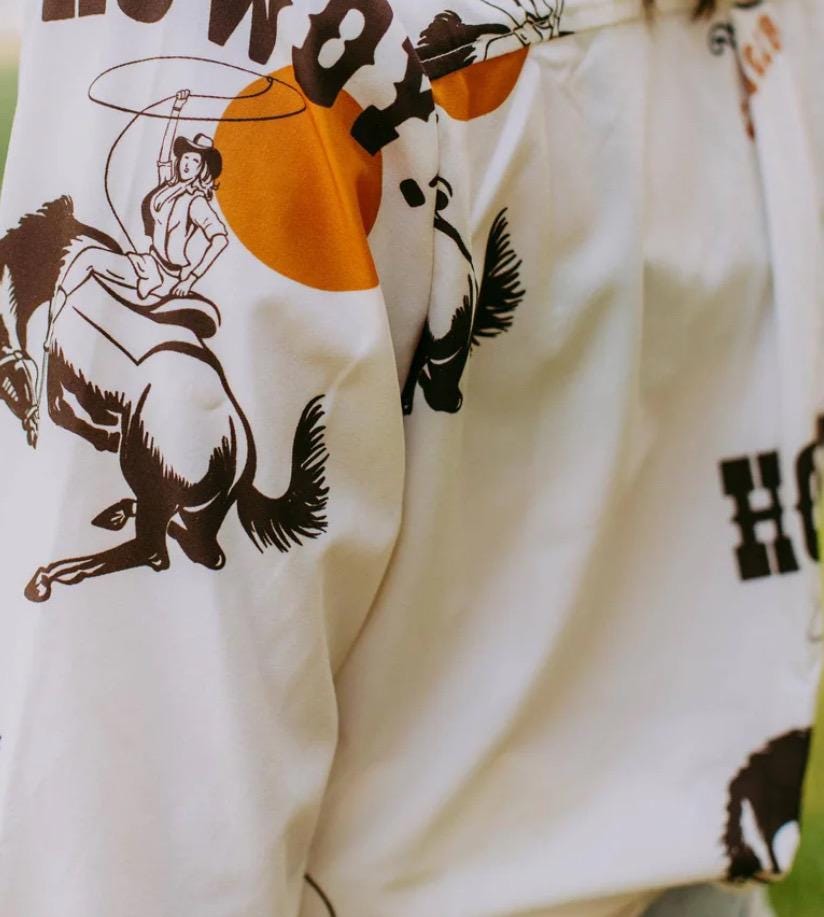 Women's Western Button-Up Shirt | Cowgirl Shirt with Retro Rodeo Vibes -This high-quality Western button-down shirt is a must-have for any cowgirl’s wardrobe! Made from 100% polyester, it offers a silky-soft feel, lightweight comfort, and all-day breathability—perfect for rodeos, nights out, or everyday Western wear.
✨ Why You’ll Love This Shirt:
✔️ Premium Fabric: Crafted from luxurious, high-quality polyester, this blouse is ultra-soft and smooth to the touch. SHIPS FREE from MONTANA toda