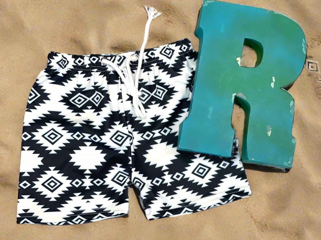 Matching Western Swimsuits for Kids 🖤🤍  Western Black and White Swimsuits, Boys Swim Trunks, Girls One Piece Swim
How fabulous are these matching swimsuits for your little cowboys and cowgirls?! Western sibling swimsuits have never been cuter! Featuring a stunning black and white Aztec/geometric pattern, these swimsuits come in your choice of:
✔️ Boys Trunks (can double as day shorts!)
✔️ Girls' One-Piece Swimsuit
SHIPS FREE FROM MONTANA WITH $35+ PURCHASE