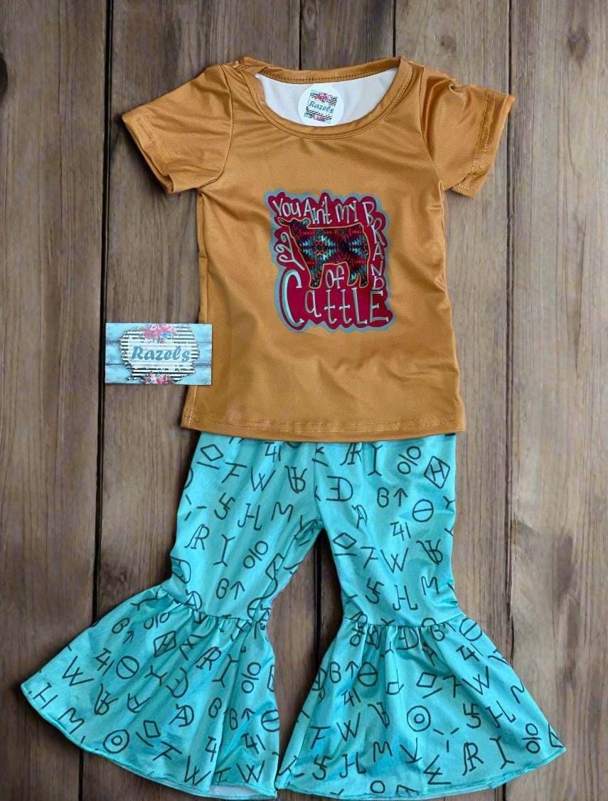 LAST ONE! 🛑 $10 CLOSEOUT – Size 3T "You Ain’t My Brand of Cattle" Bell Bottom Set | Cowgirl Outfit | Turquoise Cattle Brand Flares What a fun and sassy outfit for your little cowgirl! 🤠 This final set in size 3T includes a mustard yellow tee paired with turquoise cattle brand bell bottoms—perfect for rodeos, playdates, and everyday adventures! ✔ FINAL SALE – Only $10 plus FREE shipping from Montana on orders $35 plus!