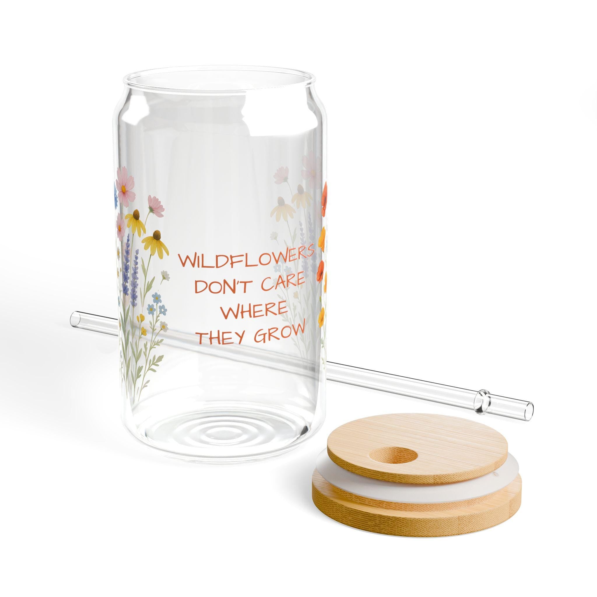 WILDFLOWERS DON'T CARE WHERE THEY GROW—and now your drinkware can bloom just as freely. Whether you're enjoying iced coffee on the porch or lemonade in the sunshine, this floral glass adds a little joy to every sip.  Features you'll love: ✓ Custom name or phrase printed among the wildflowers ✓ 16 oz clear tempered glass with a vibrant floral design ✓ Optional bamboo lid + eco-friendly Tritan straw 🥤 ✓ BPA-free and proudly made in the USA ✓ Durable, reusable, and perfect for summer s