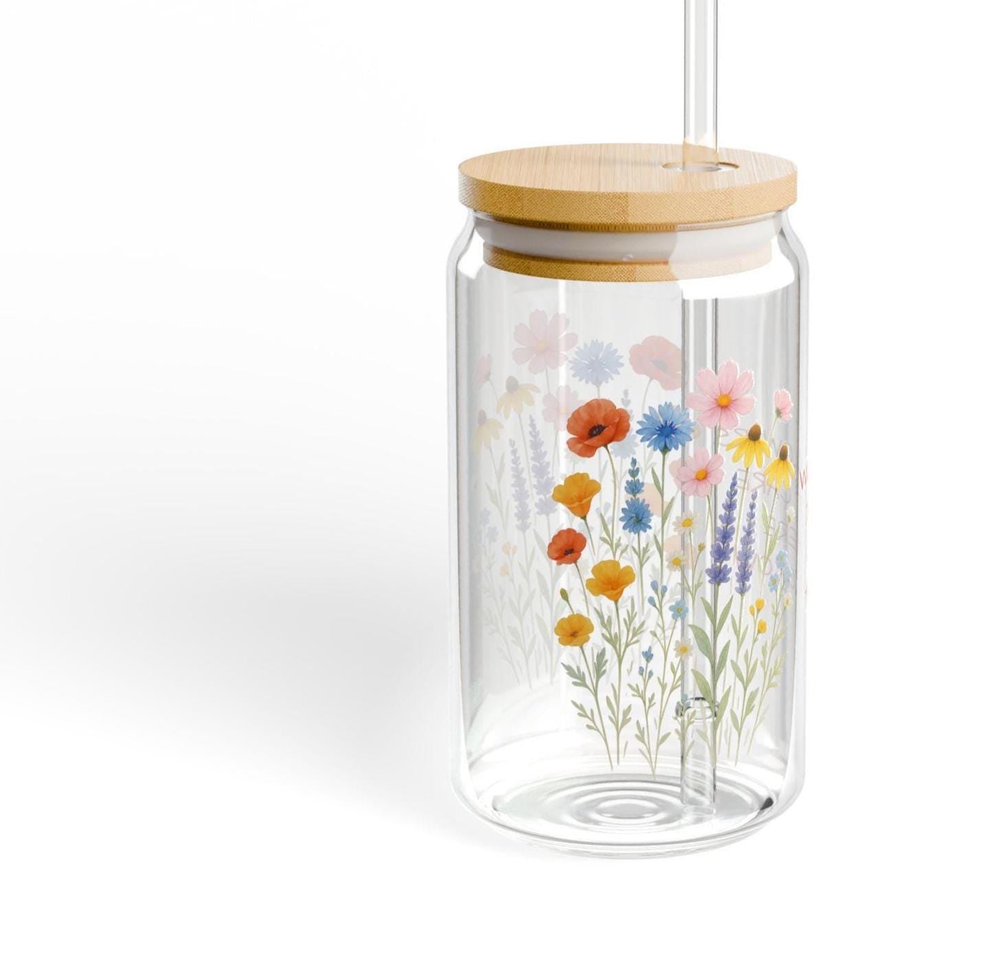 WILDFLOWERS DON'T CARE WHERE THEY GROW—and now your drinkware can bloom just as freely. Whether you're enjoying iced coffee on the porch or lemonade in the sunshine, this floral glass adds a little joy to every sip.  Features you'll love: ✓ Custom name or phrase printed among the wildflowers ✓ 16 oz clear tempered glass with a vibrant floral design ✓ Optional bamboo lid + eco-friendly Tritan straw 🥤 ✓ BPA-free and proudly made in the USA ✓ Durable, reusable, and perfect for summer s