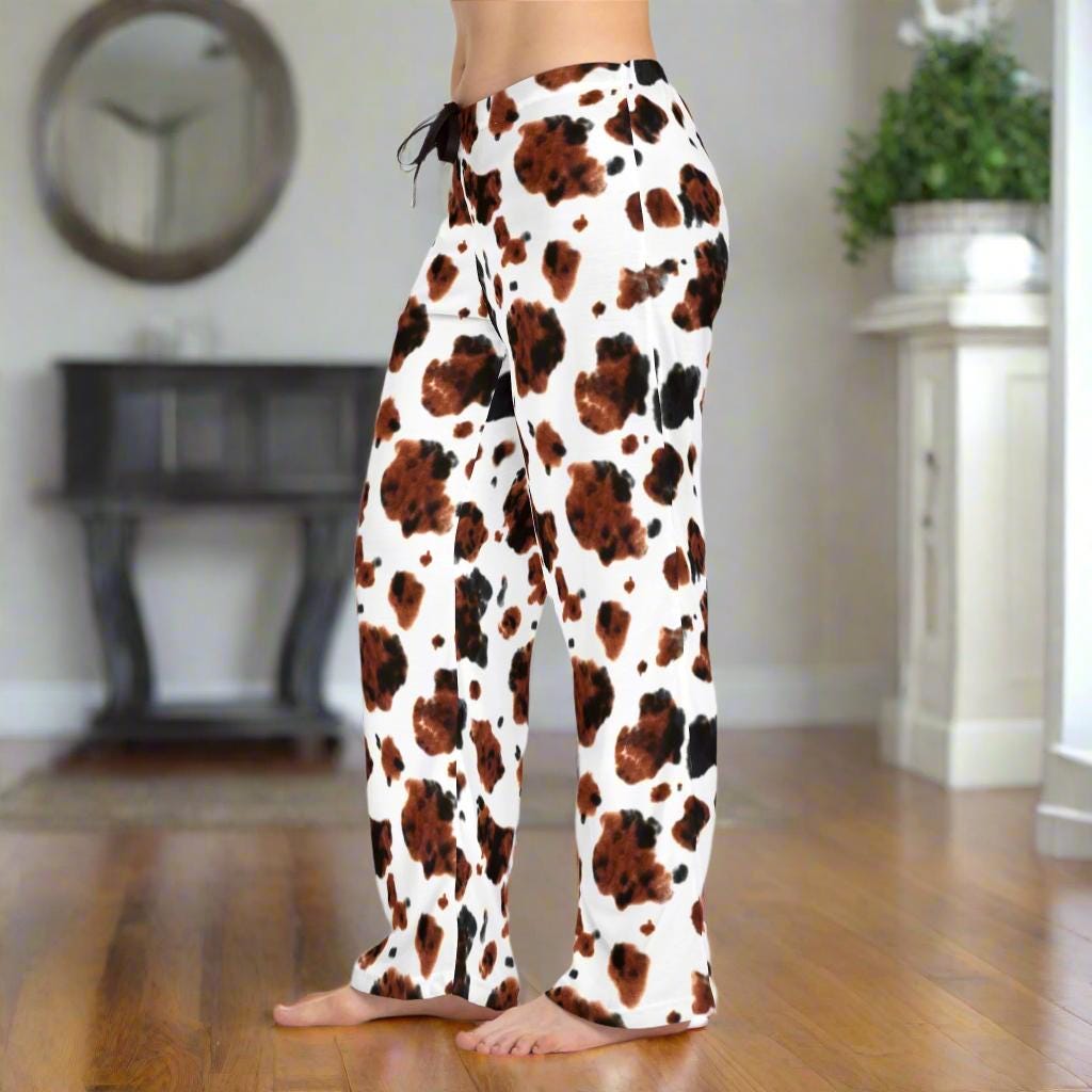 BROWN COWPRINT PAJAMA PANTS FOR WOMEN ARE COMFORTABLE AND CUTE ENOUGH TO WEAR OUT. PLUS THEY SHIP FOR FREE!
✅ 100% polyester jersey knit fabric for a soft, comfy feel
✅ Relaxed comfort fit with back elastic and drawstring tie
✅ Lightweight, breathable, and perfect for lounging or casual wear
✅ Fun and unique cowprint pattern to show off your western spirit
✅ Made to order – production time 3 days, shipping 2-5 days
✅ Available in XS to 2XL sizes