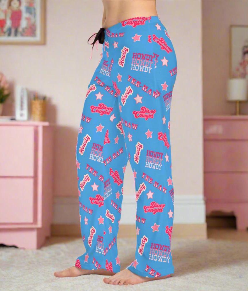 Disco Cowgirl Pajama Pants – Periwinkle Yeehaw Dreams 💫🤠
Bring the party to your pajamas! These periwinkle blue lounge pants are covered in playful phrases like "Disco Cowgirl," "Howdy," "Yee Haw," and sprinkled with stars for that extra Western sparkle. Whether you're chilling at home or planning the cutest cowgirl-themed sleepover, these fun PJs bring bold cowgirl energy to every moment.