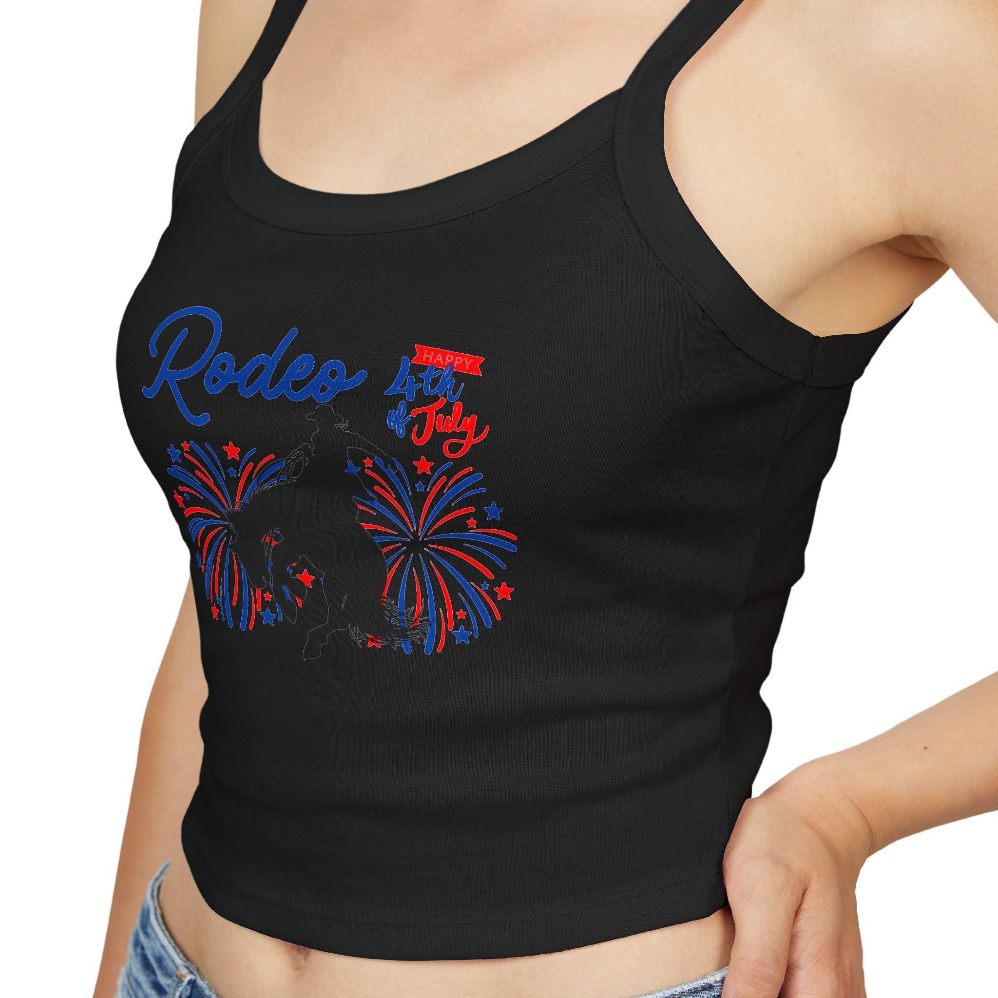 Rodeo Crop Tank – Bronc Rider & Fireworks for the 4th of July
Celebrate Independence Day with a little rodeo flair! This cropped spaghetti strap tank features our bold bronc rider silhouette bursting through red, white, and blue fireworks—perfect for cowgirls who love freedom, fashion, and a little yeehaw energy 🤠🎆
Made from a buttery-soft cotton blend with supportive thick straps, it’s made for sunny parades, backyard BBQs, or dancing under fireworks.