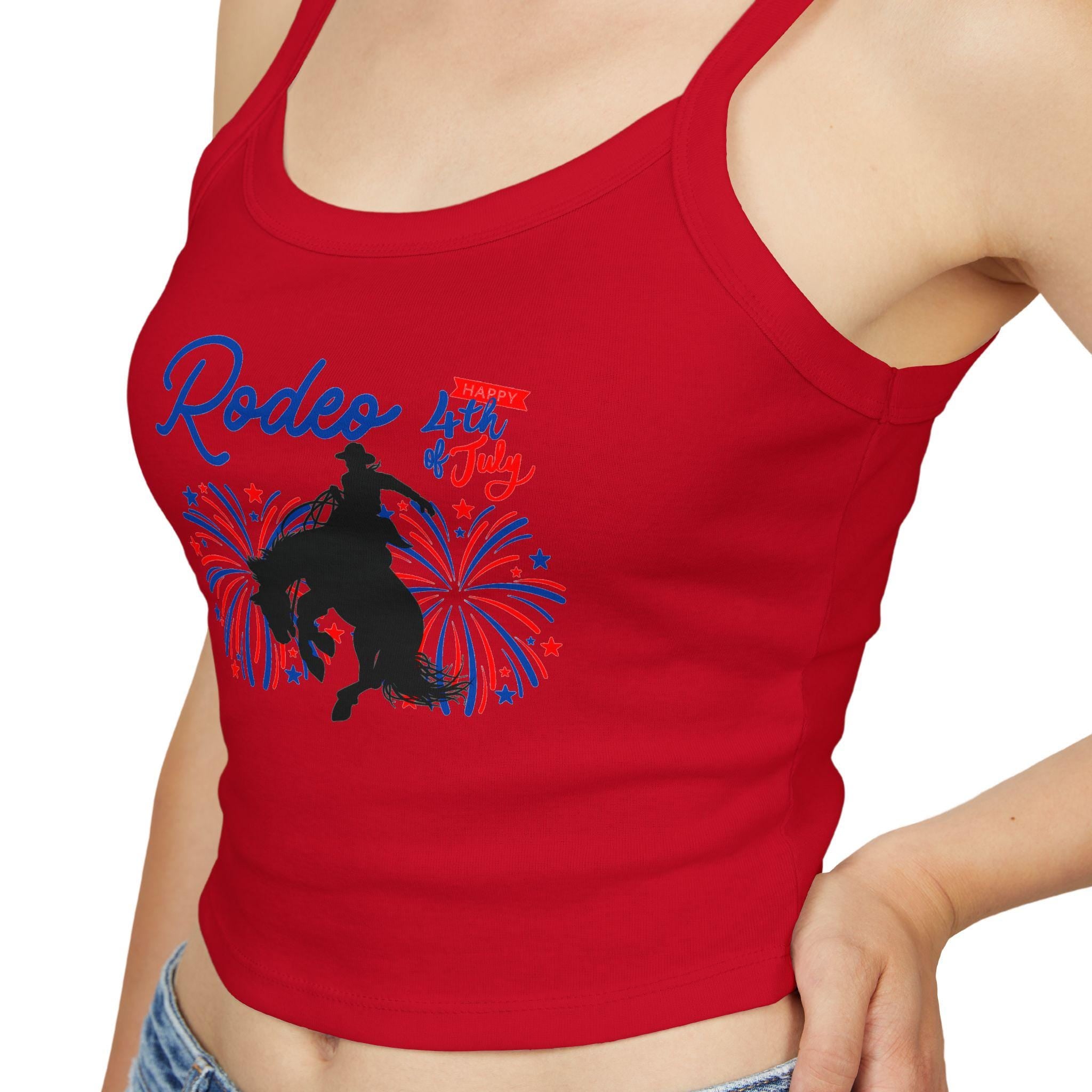 Rodeo Crop Tank – Bronc Rider & Fireworks for the 4th of July
Celebrate Independence Day with a little rodeo flair! This cropped spaghetti strap tank features our bold bronc rider silhouette bursting through red, white, and blue fireworks—perfect for cowgirls who love freedom, fashion, and a little yeehaw energy 🤠🎆
Made from a buttery-soft cotton blend with supportive thick straps, it’s made for sunny parades, backyard BBQs, or dancing under fireworks.