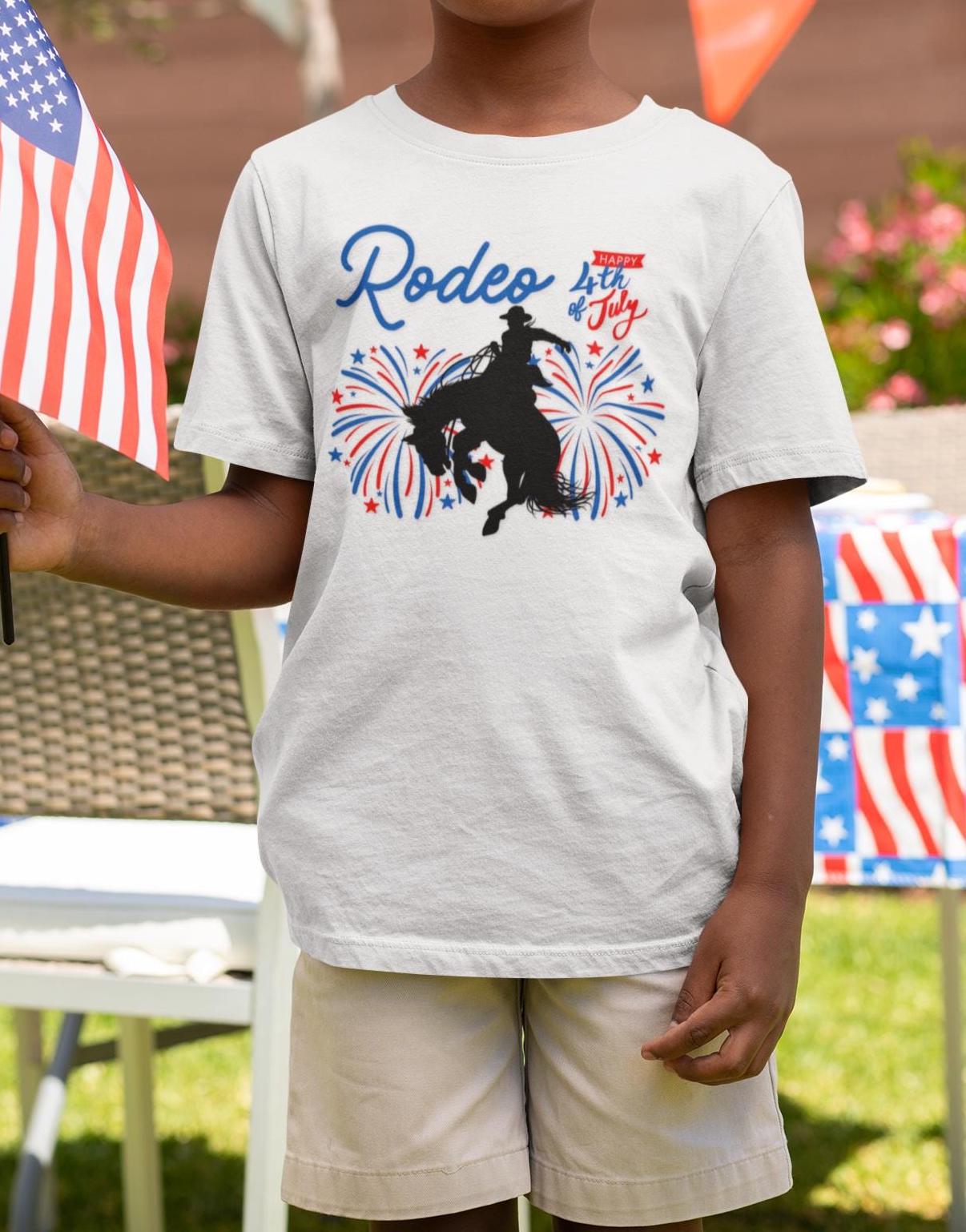 Patriotic Kids’ Rodeo Tee – Bronc Rider Graphic for 4th of July Fun!
Let the littles join in on the rodeo spirit this Independence Day! Featuring the same bronc rider bursting through red, white, and blue fireworks as our adult tee, this youth-sized shirt is perfect for creating matching family looks for the 4th of July 🎆🐎