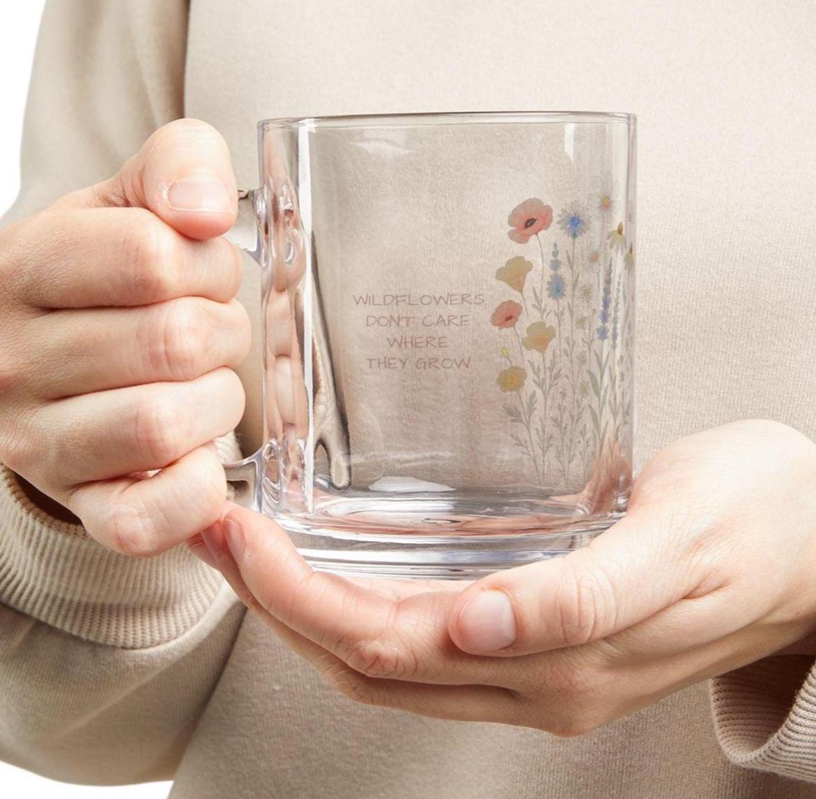“Wildflowers don’t care where they grow” — and neither do your cozy moments. 🌿 This beautiful 10oz glass mug brings nature-inspired charm to your morning tea, afternoon coffee, or evening wind-down. Personalize it with a name or your own wildflower quote to create a heartfelt gift that’s as unique as the person sipping from it.  Perfect for tea lovers, garden enthusiasts, or anyone who enjoys sipping in style.