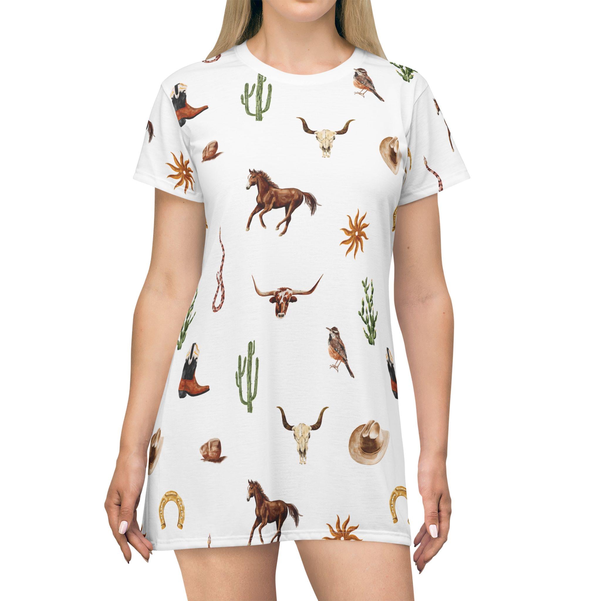 Saddle up in style with this Western T-Shirt Dress—a laid-back essential with cowboy charm and desert-inspired flair. Designed for easy summer days, this dress brings together comfort and Western fashion in one effortlessly cool look.
✓ Soft, lightweight 100% polyester for all-day comfort
✓ Relaxed fit with side seams to keep its shape
✓ Self-fabric binding for a clean, finished look
✓ Tagless for maximum comfort
✓ Runs true to size