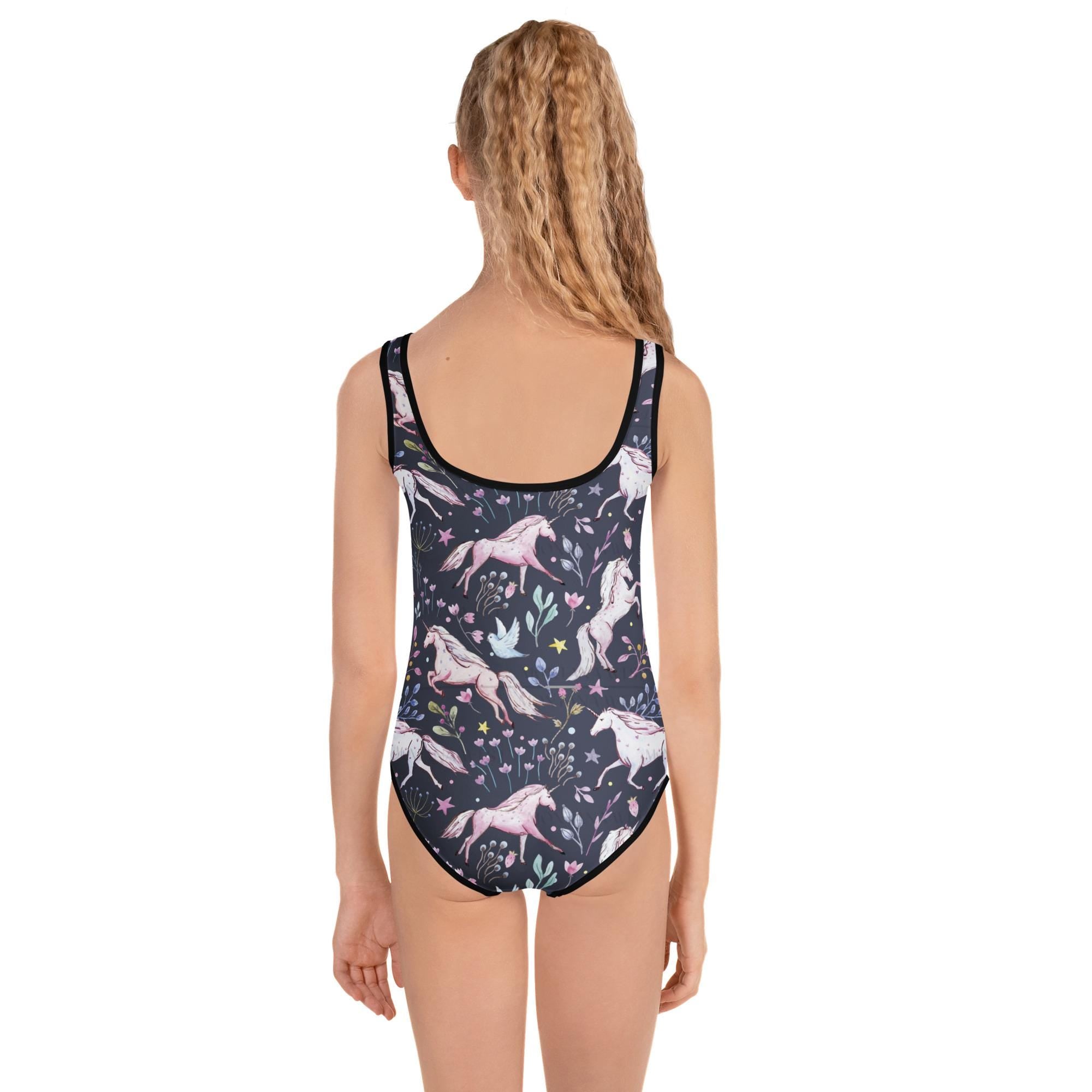 🦄 Unicorn & Flowers Kids Swimsuit – Navy Magic!
Make a splash in unicorn style! This navy one-piece swimsuit features a dreamy all-over print of white unicorns and soft florals—perfect for little ones who love a mix of whimsy and adventure. With its comfy fit, stretch fabric, and fade-resistant colors, this suit is made for cannonballs, beach days, and endless summer fun.
✓ 38–40 UPF sun protection built in