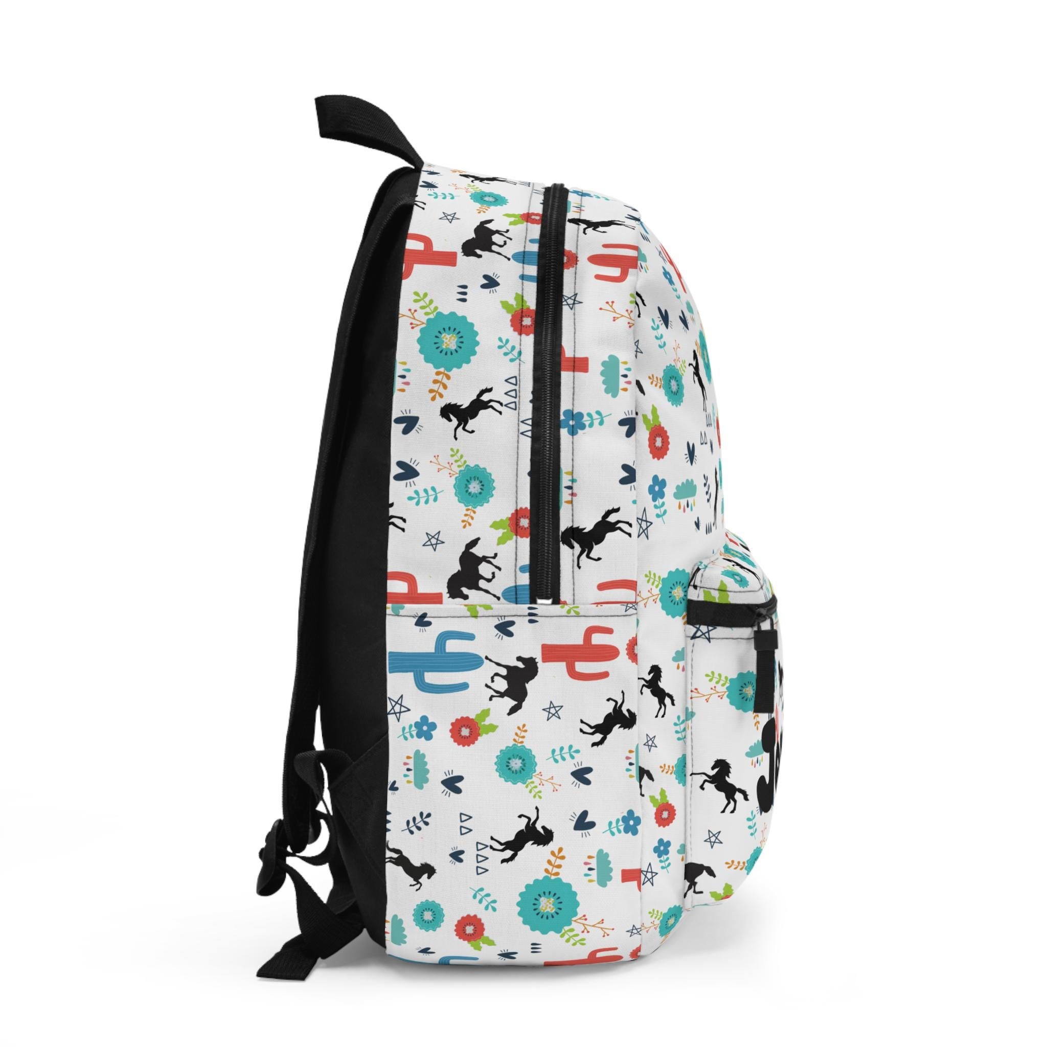 Personalized Horse Backpack for Kids – Fun Western Print with Black Horses, Cacti & Desert Blooms
✓ Custom name option – uniquely hers or left blank
✓ Made from durable 100% polyester – tough enough for daily use
✓ Comfy padded back & shoulder straps – all-day wear approved
✓ Multiple compartments – room for books, snacks, and toy ponies
✓ Secure zipper closures – to keep all her treasures safe
✓ Adjustable straps – grows with her for the perfect fit