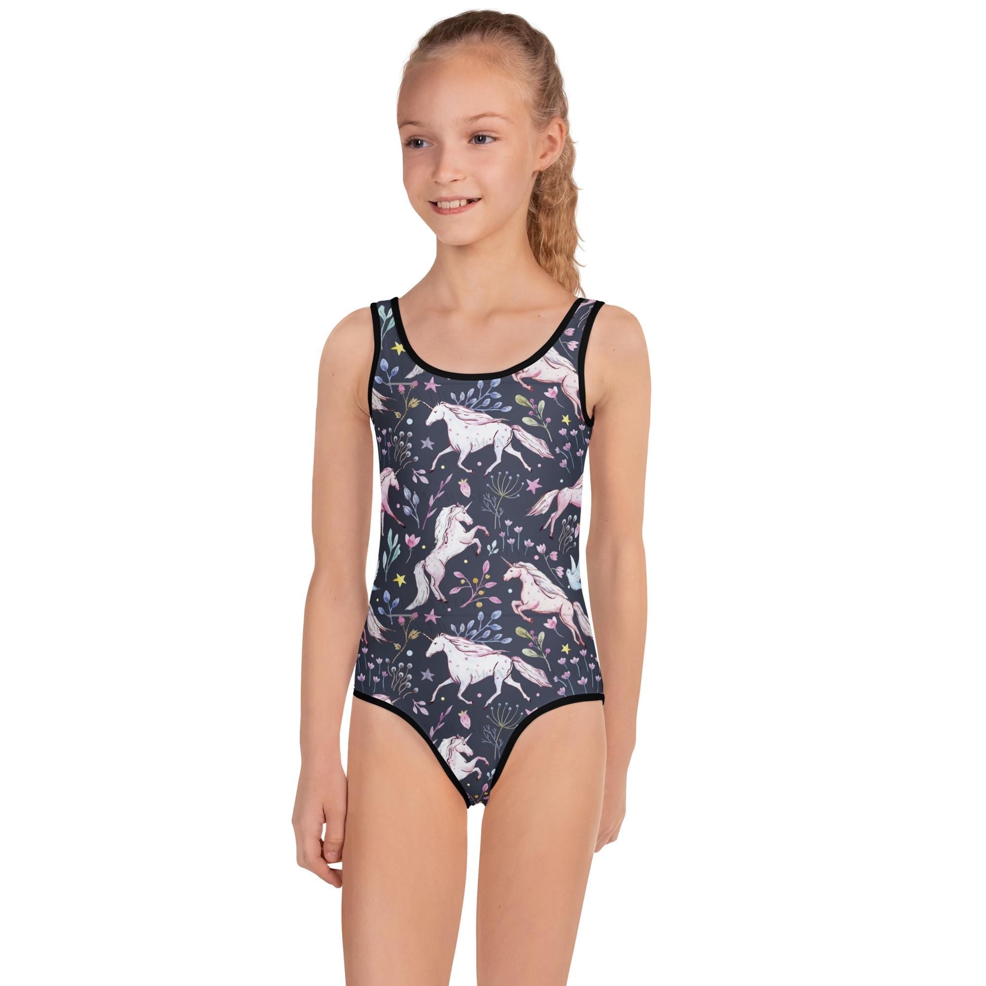 🦄 Unicorn & Flowers Kids Swimsuit – Navy Magic!
Make a splash in unicorn style! This navy one-piece swimsuit features a dreamy all-over print of white unicorns and soft florals—perfect for little ones who love a mix of whimsy and adventure. With its comfy fit, stretch fabric, and fade-resistant colors, this suit is made for cannonballs, beach days, and endless summer fun.
✓ 38–40 UPF sun protection built in