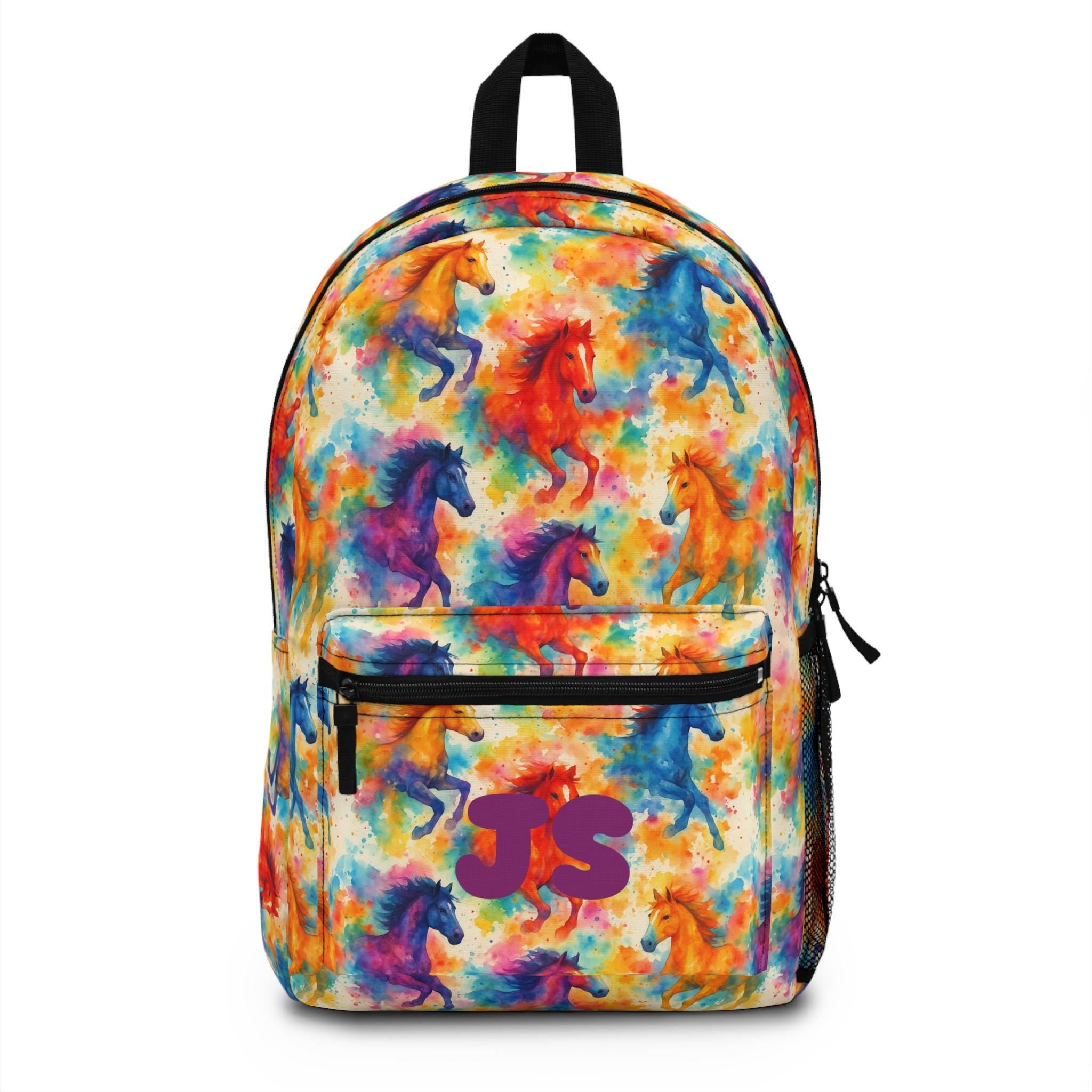 ✓ Bold allover watercolor horse pattern
✓ Custom name or initials on the front pocket
✓ Spacious design fits books, tablets & more
✓ Padded straps & back for comfy wear
✓ Side mesh pockets & front zip pocket for essentials
✓ FREE Shipping in the USA! 🚚 Please allow 5 days for production plus shipping.
