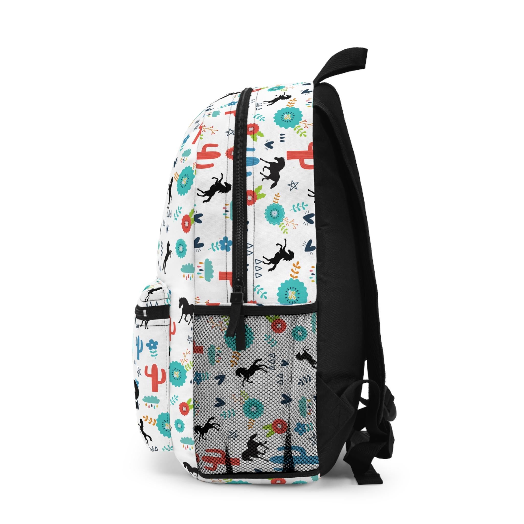 Personalized Horse Backpack for Kids – Fun Western Print with Black Horses, Cacti & Desert Blooms
✓ Custom name option – uniquely hers or left blank
✓ Made from durable 100% polyester – tough enough for daily use
✓ Comfy padded back & shoulder straps – all-day wear approved
✓ Multiple compartments – room for books, snacks, and toy ponies
✓ Secure zipper closures – to keep all her treasures safe
✓ Adjustable straps – grows with her for the perfect fit