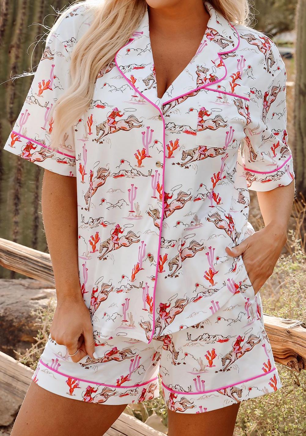 Pink Cowgirl Pajama Short Set 🩷
Yeehaw and sweet dreams, darlin'!
Embrace your inner cowgirl with this adorable pink pajama set, designed for the wild-at-heart who also love their beauty sleep. This western short set is as cozy as it is cute—perfect for warm summer nights, bachelorette parties, birthday gifts, or just treatin’ yourself to some cowgirl charm.
How cowgirl-tastic is this set?!
✓ Features a short-sleeve button-up top with hot pink piping
