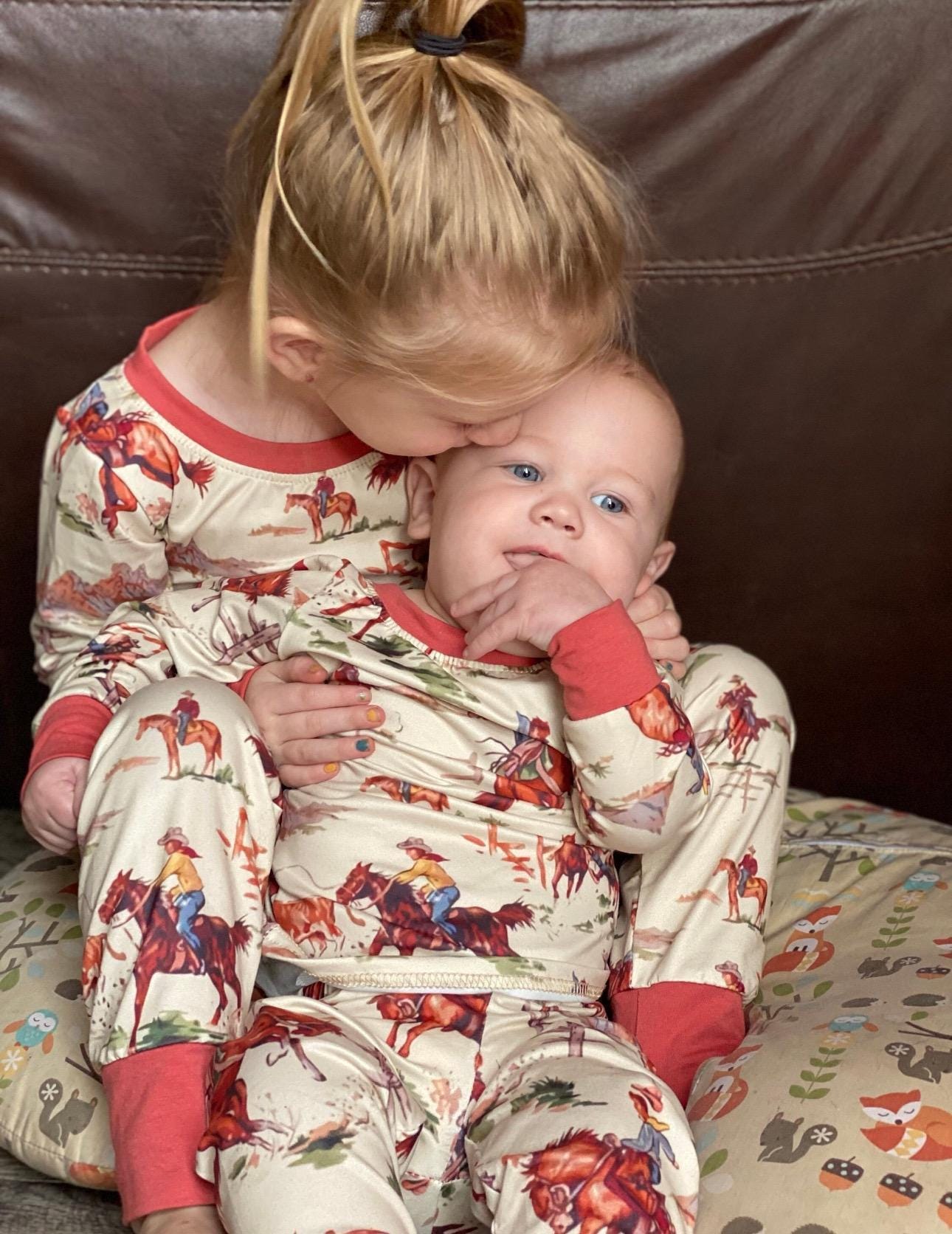 Saddle up with our exclusive Cowboy Pajamas featuring retro bucking broncs, roping steers, and steer wrestling! They’re comfy, stretchy, and true to size. Perfect for little wranglers and the whole family! Shop Razels for matching Western family PJs!