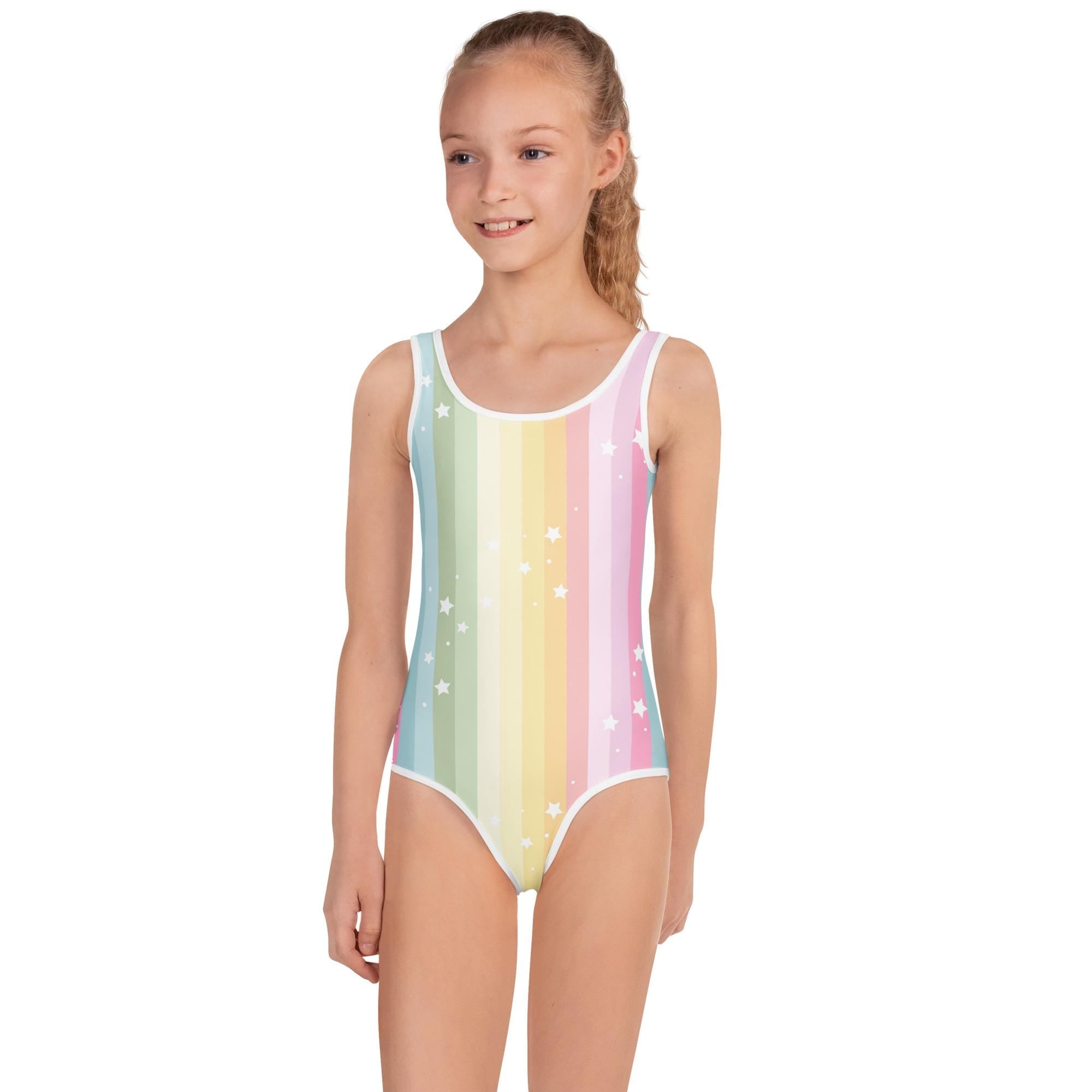 🌈 Girls Pastel Rainbow & Stars Swimsuit – Shine Bright in the Water! ⭐💖
Let her splash, swim, and shine in this dreamy pastel rainbow swimsuit sprinkled with white stars! Designed for comfort, confidence, and fun, this suit features a soft, stretchy fit and a vibrant print that holds up to sunshine and swim days.
With a double-layered front and UPF 38–40 sun protection, it’s made to move while keeping her safe and secure—no fuss, just fun!