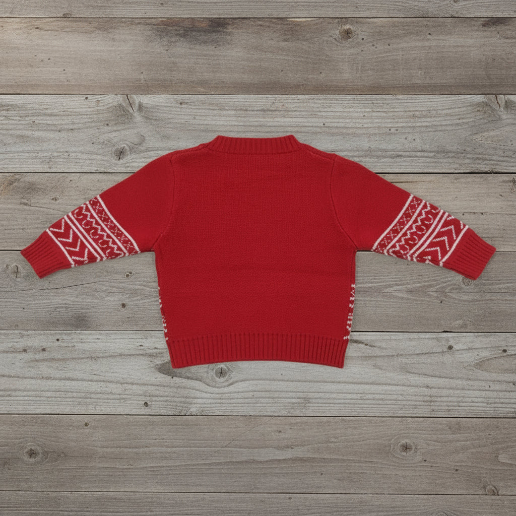 Red sweater with white patterned sleeves on a textured white background