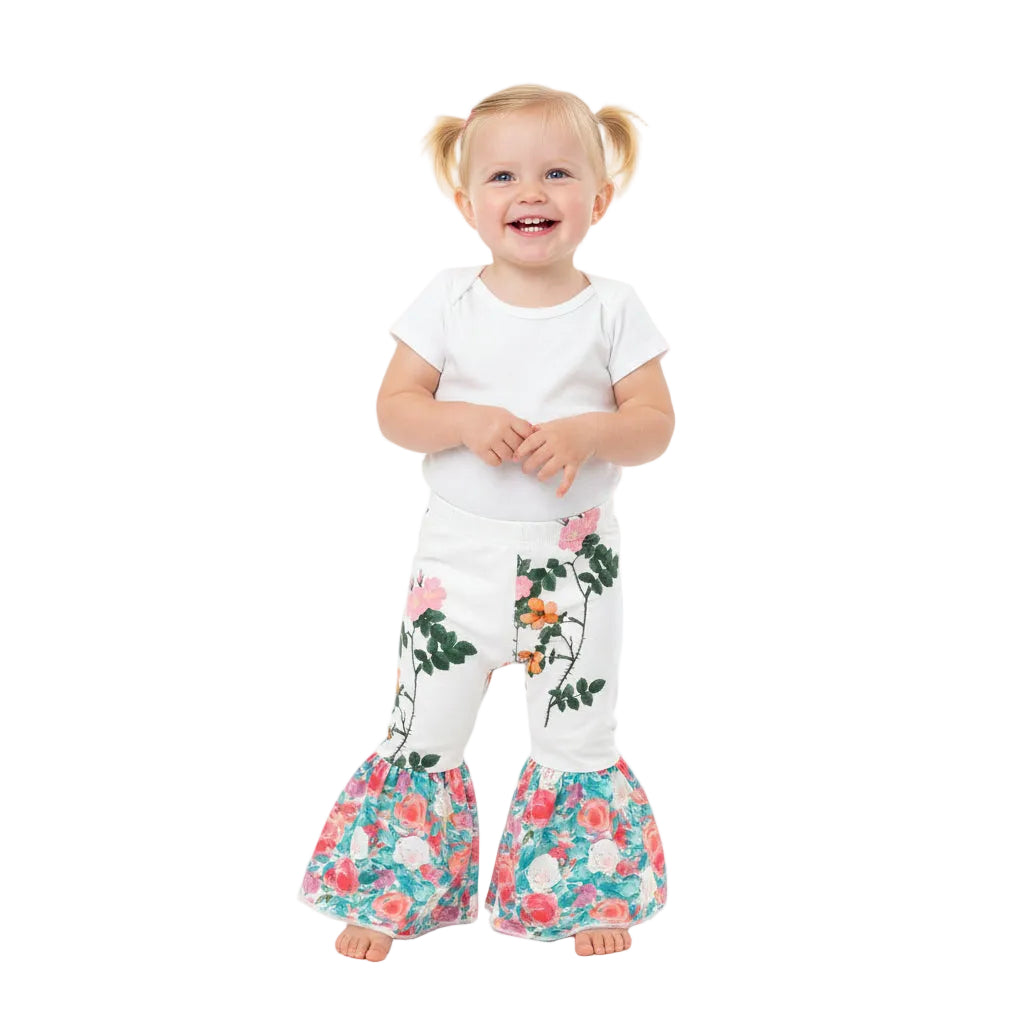 Floral Bell Bottoms designed with vibrant flower patterns and fun, playful colors are made with high-quality materials that promise comfort and durability, ensuring they’ll be a favorite all season long. These Wildflower pants will not disappoint!