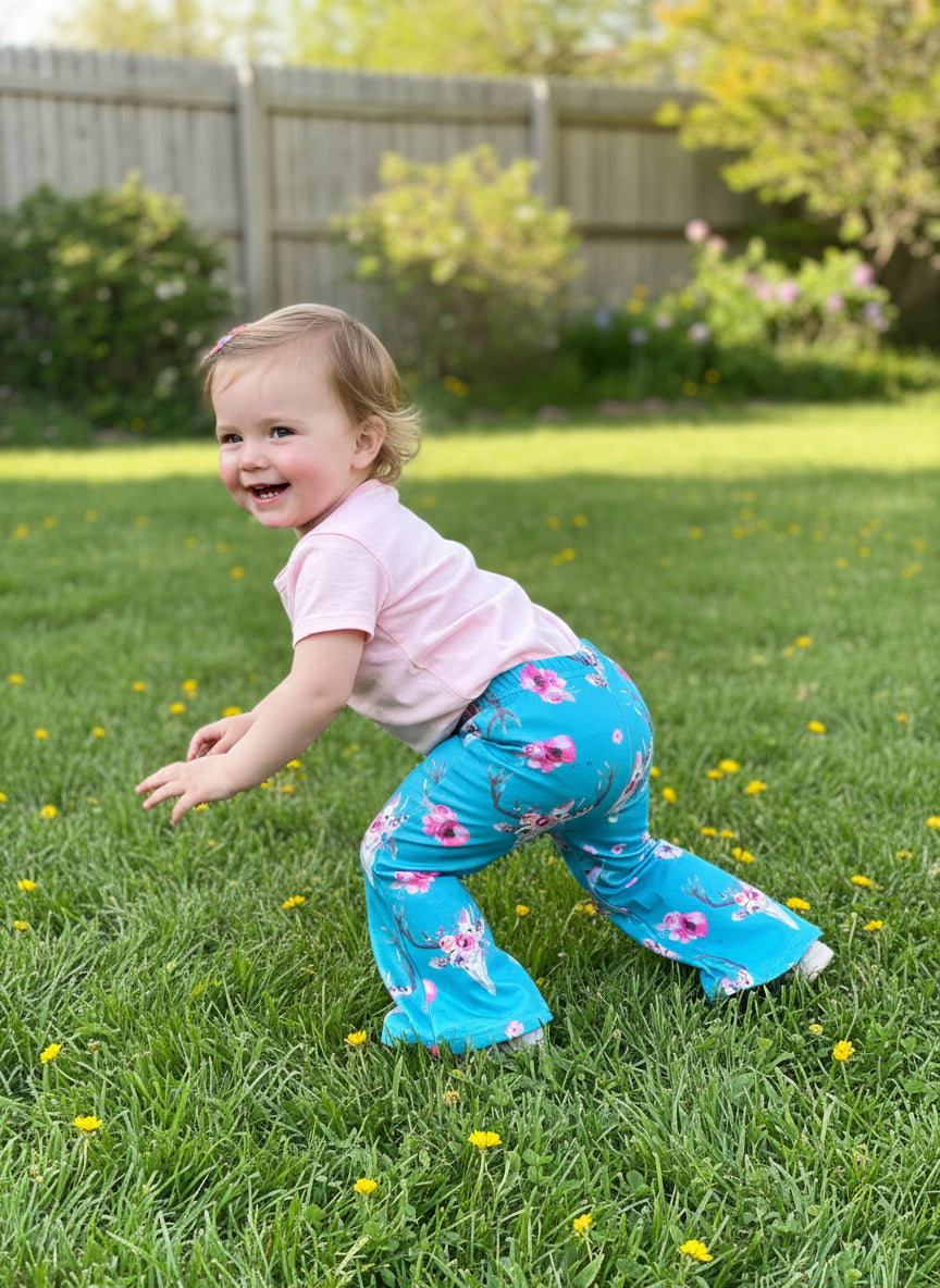 Baby & Toddler Bell Bottoms in a fun flower skull boho print! Perfectly stretchy with the ideal flare, these versatile pants are great for dressing up or down. and are machine washable! Shop Razels for more! Ships FREE with $35+ purchase