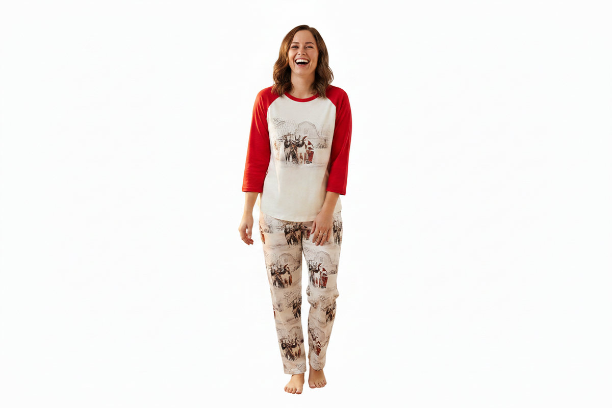WOMAN STANDING WEARING RAZELS ADULT UNISEX SLEIGH RIDE PJS AGAINST WHITE BACKGROUND