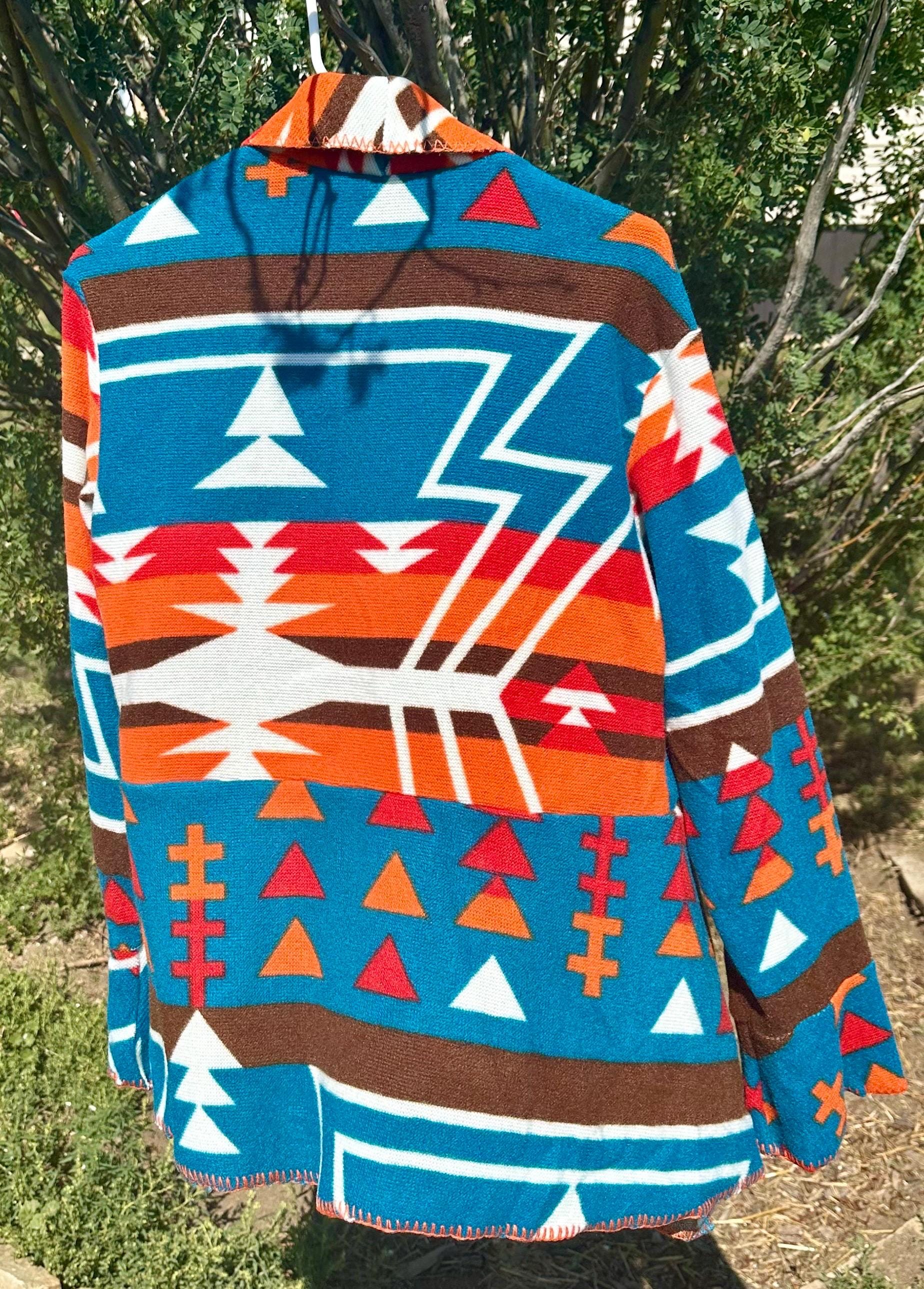 Fall Must-Have: Western Cardigan Jacket

Stand out this season with our Western Cardigan Jacket in bold turquoise and orange! Lightweight, flowy, and packed with style, it’s the perfect layering piece for cool fall days.
