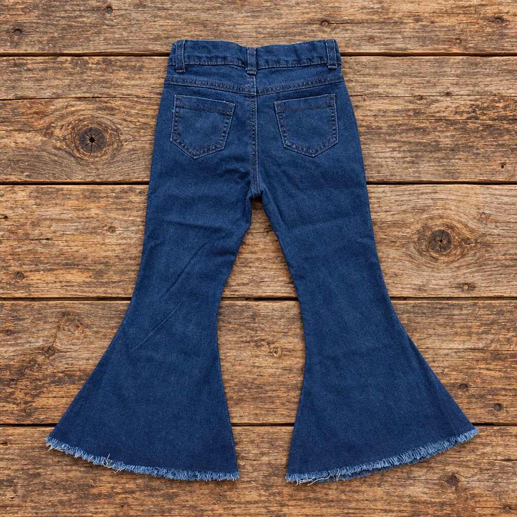 BACK OF GIRLS WESTERN JEANS ON BARNWOOD