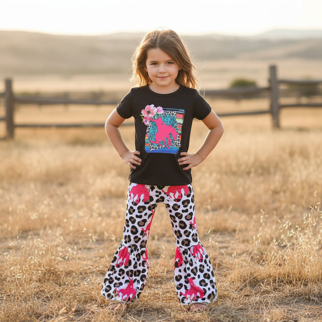 Cowgirl Bell Bottom Outfit featuring Pink Bronc Rider silhouettes and bold animal print! Perfect for rodeo fans and little ones who love a touch of Western flair, this Girls Bell Bottom Set is both stylish and fun. Ships FREE with $35+ order