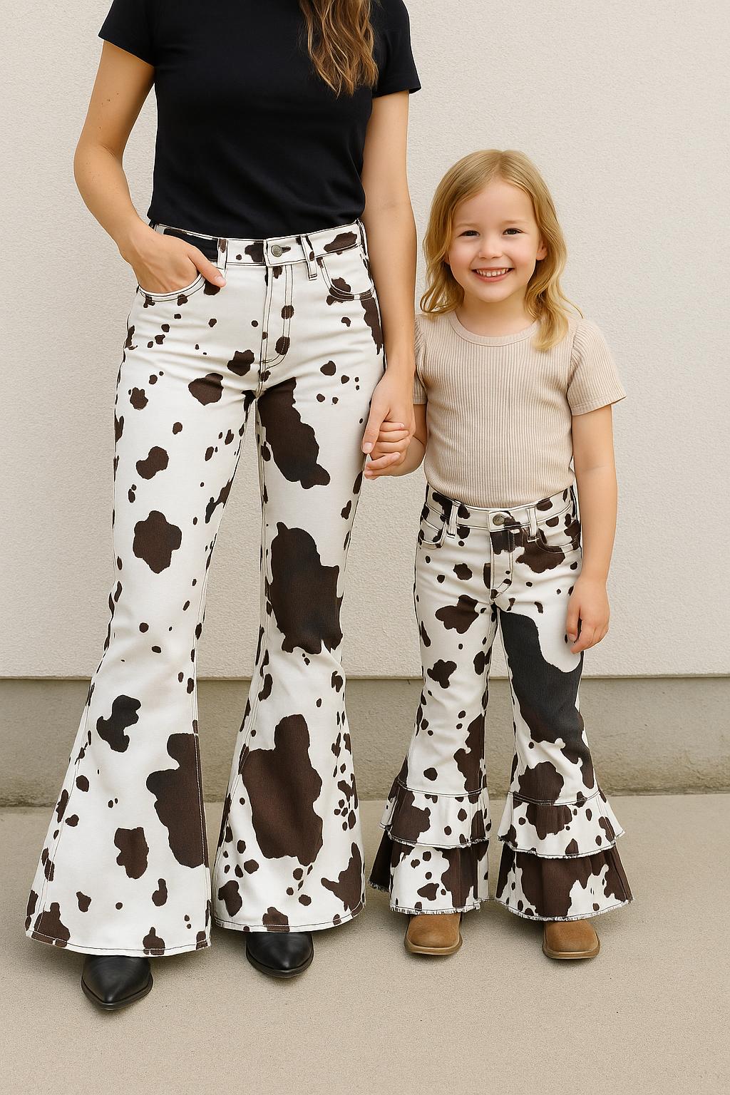 🐄 Cowprint Cowgirl Jeans – Women’s Western Bell Bottoms | Matching Mom + Me Outfit | Fall & Rodeo Style

Back by wild demand — now in adult sizes! 🤎
These Cowprint Cowgirl Jeans are the ultimate blend of stretch, sass, and Western flair, made for mamas who love to twin with their little cowgirls (or just love a bold pair of bells!).