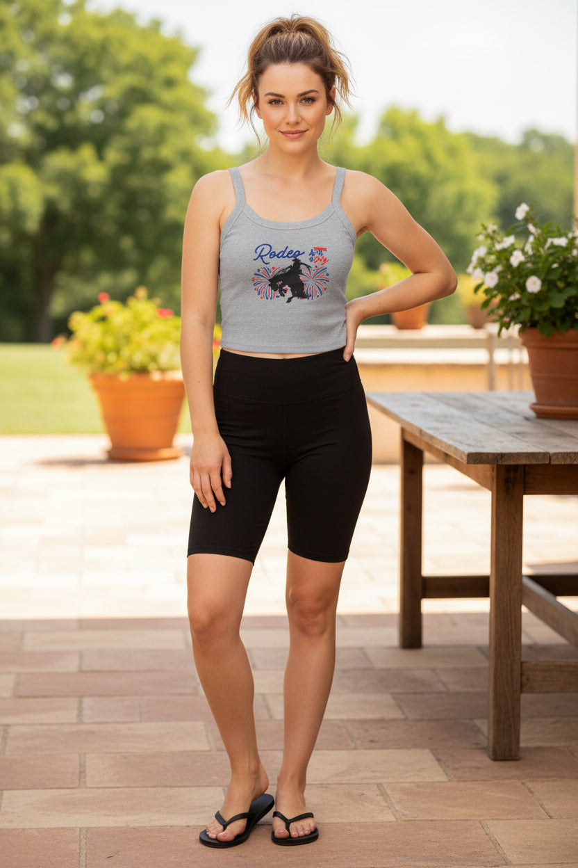 Rodeo Crop Tank – Bronc Rider & Fireworks for the 4th of July
Celebrate Independence Day with a little rodeo flair! This cropped spaghetti strap tank features our bold bronc rider silhouette bursting through red, white, and blue fireworks—perfect for cowgirls who love freedom, fashion, and a little yeehaw energy 🤠🎆

Made from a buttery-soft cotton blend with supportive thick straps, it’s made for sunny parades, backyard BBQs, or dancing under fireworks.