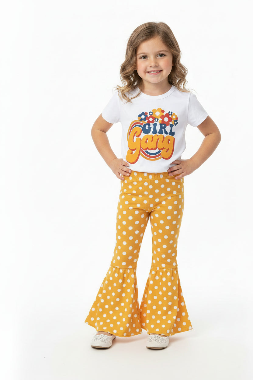 Girl Gang Shirt and Yellow Polka Dot Bell Bottom Outfit – Retro Floral Vibes for Girls!  🌼💪🏽

This fun, bright Polka Dot Bell Bottom outfit is perfect for your little fashionista! I love the retro floral vibe, and what could be more fun than yellow polka dot bell bottoms? This adorable outfit is ready for sunshine and warm weather! 🌞 Or, pair it with a denim jacket for those cooler days, especially if you live in Montana like us! 😉🤠Ships FREE with $35+ purchase from MONTANA.