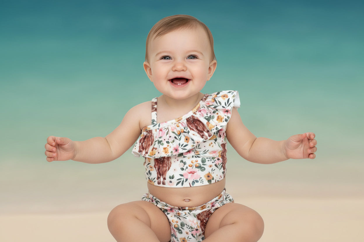 Highland Cow Swimsuit – The Sweetest Western Tankini! 🐂💖
Calling all Highland Cow lovers! This adorable Highland Cow Swimsuit features the funnest (yes, that's a word for this cuteness!) Scottish Highlander Cows and Flowers in a stylish tankini design. With a ruffled neckline and a skirted bottom, this Cowgirl Swimsuit for Kids is as sweet as it is fun! 🌸🐂

✔ Available Sizes: 0-3 months to 8/9!