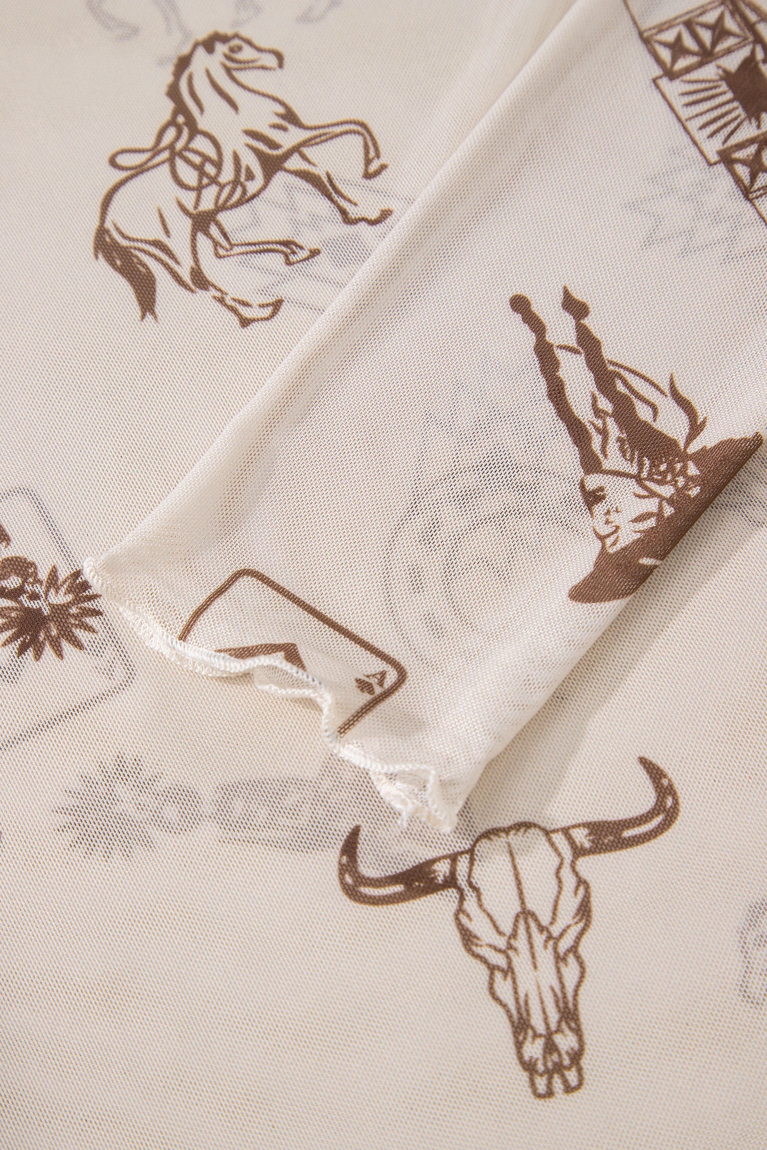 Close-up of MESH LONG SLEEVE cowboy-themed iWOMENS SHIRT