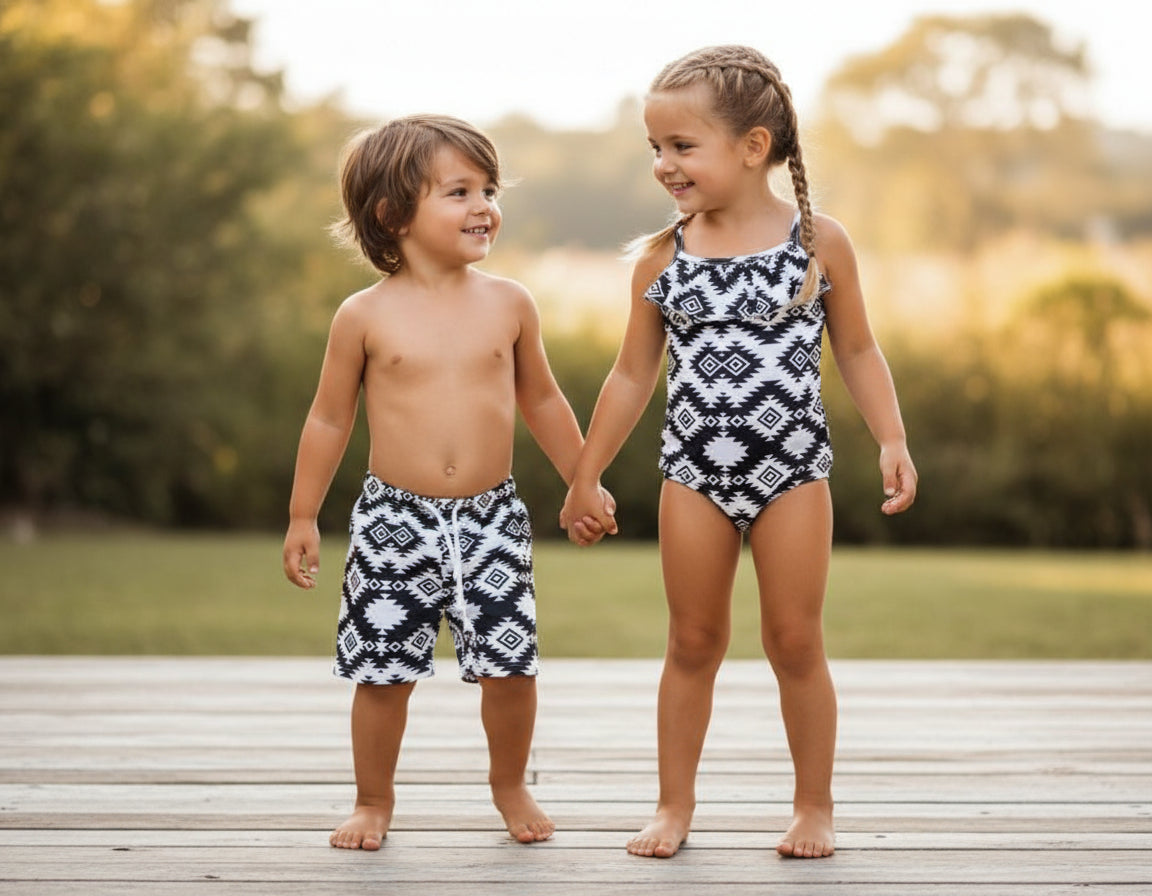 Matching Western Swimsuits for Kids 🖤🤍  Western Black and White Swimsuits, Boys Swim Trunks, Girls One Piece Swim

How fabulous are these matching swimsuits for your little cowboys and cowgirls?! Western sibling swimsuits have never been cuter! Featuring a stunning black and white Aztec/geometric pattern, these swimsuits come in your choice of:
✔️ Boys Trunks (can double as day shorts!)
✔️ Girls&#39; One-Piece Swimsuit
SHIPS FREE FROM MONTANA WITH $35+ PURCHASE
