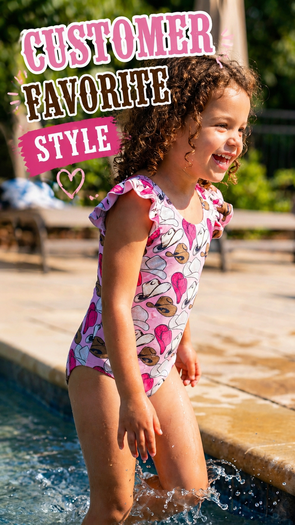 Child in a pink swimsuit with cowgirl hats and ruffles standing by a pool. overlay says CUSTOMER FAVORITE STYLE