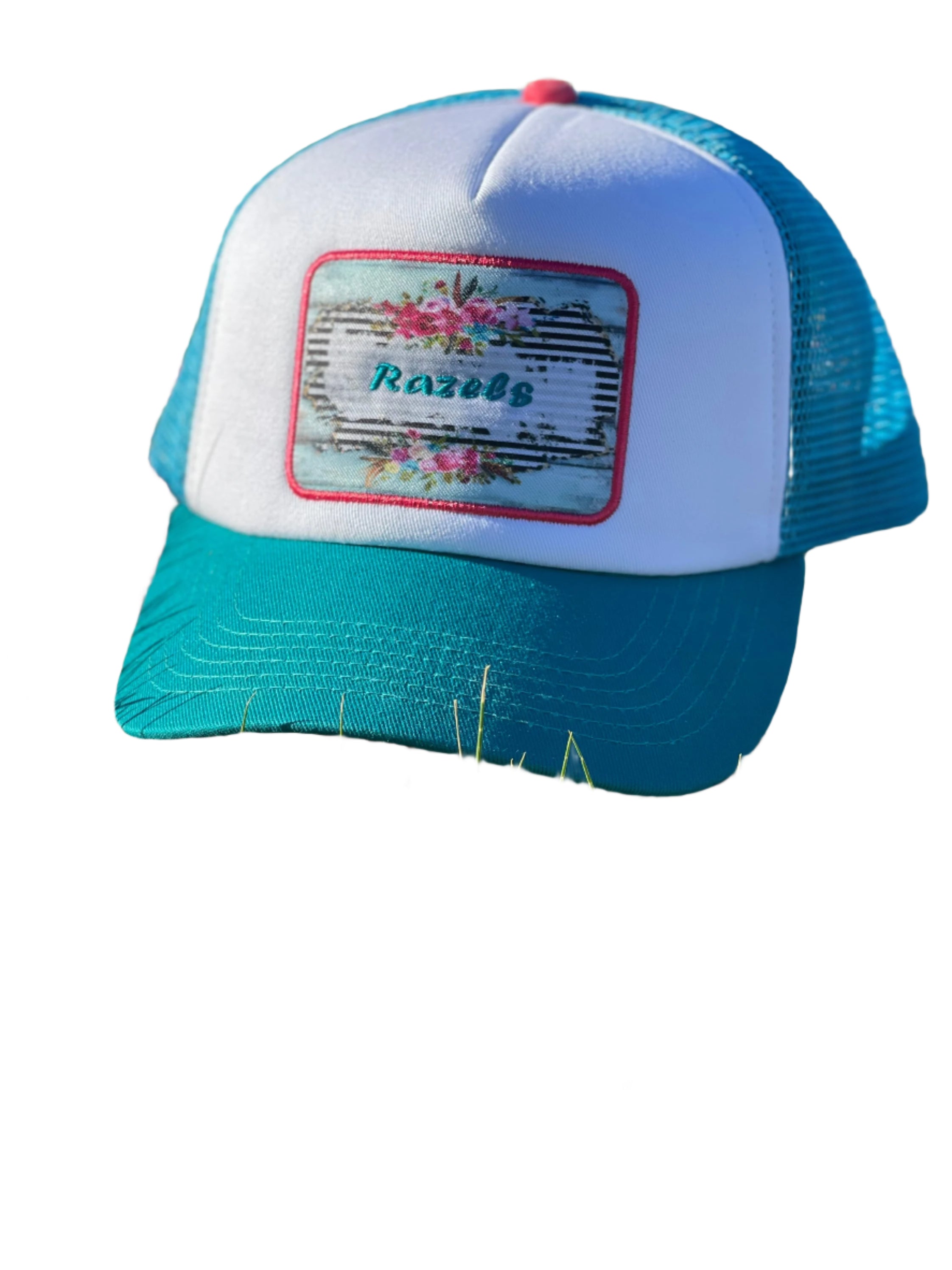 These high-quality 5-panel trucker caps are perfect for adding a playful touch to any outfit. Featuring a snapback closure for a comfortable fit and a charming Razels patch, these caps blend style with functionality.