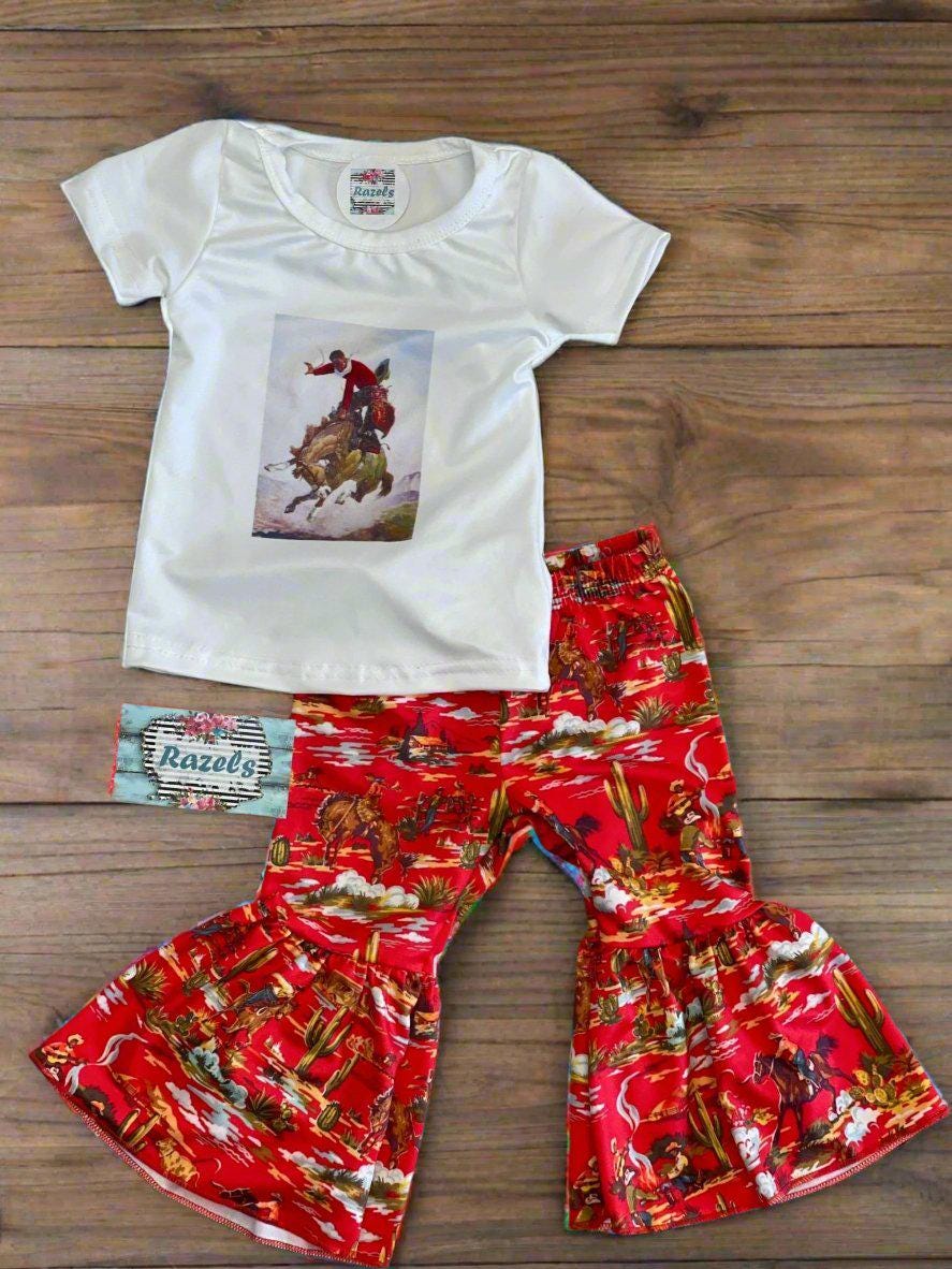 FLAT LAY OF RAZELS  Red Bell Bottoms and a stylish Cowboy T-Shirt 

Let your little one embrace vintage Western charm with this adorable Bell Bottom Outfit! Featuring bold Red Bell Bottoms and a stylish Cowboy T-Shirt with a retro Vintage Cowboy Cowgirl design, this set is perfect for rodeos, playdates, and everyday adventures.

✨ Soft & Stretchy (95% Cotton, 5% Spandex) – All-Day Comfort
✨ True to Size (TTS) for the Perfect Fit
✨ Perfect for Rodeos, Photos, & Western-Themed Events
✨ Razels FREE Shipp