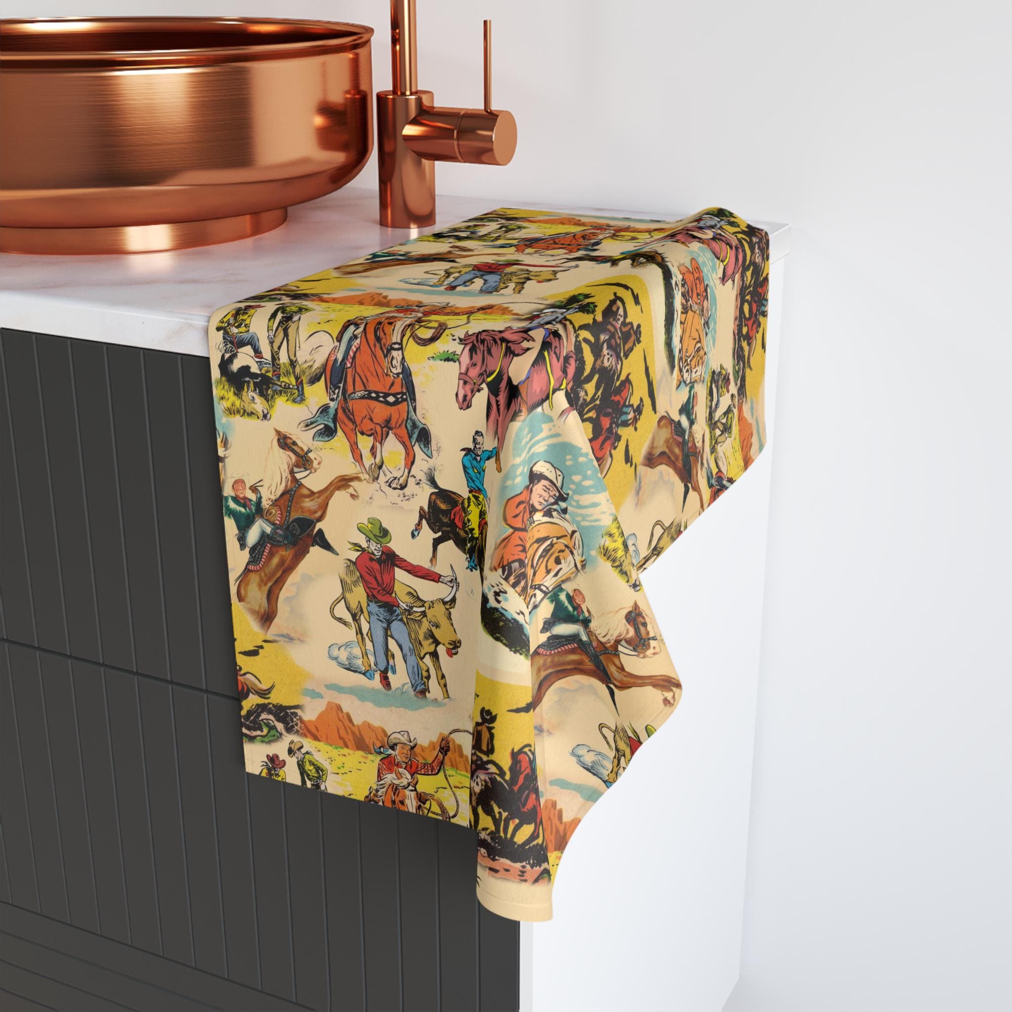 Ceramic sink with a colorful cowboy-themed towel draped over it