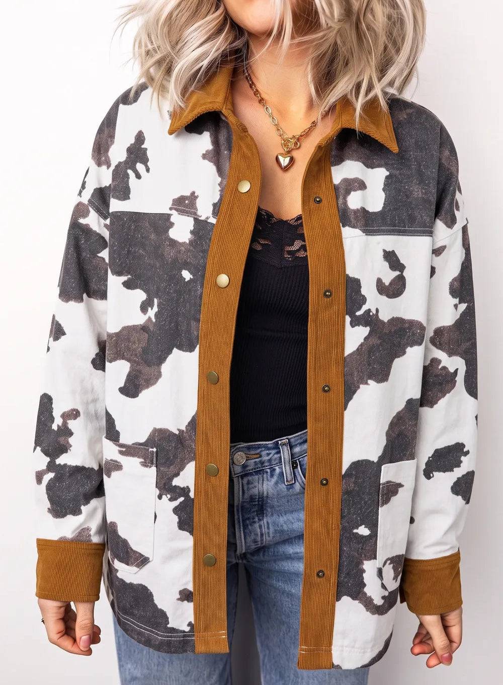 woman wearing Womens Cow print Denim Shacket Jacket with Brown Trim  against white background