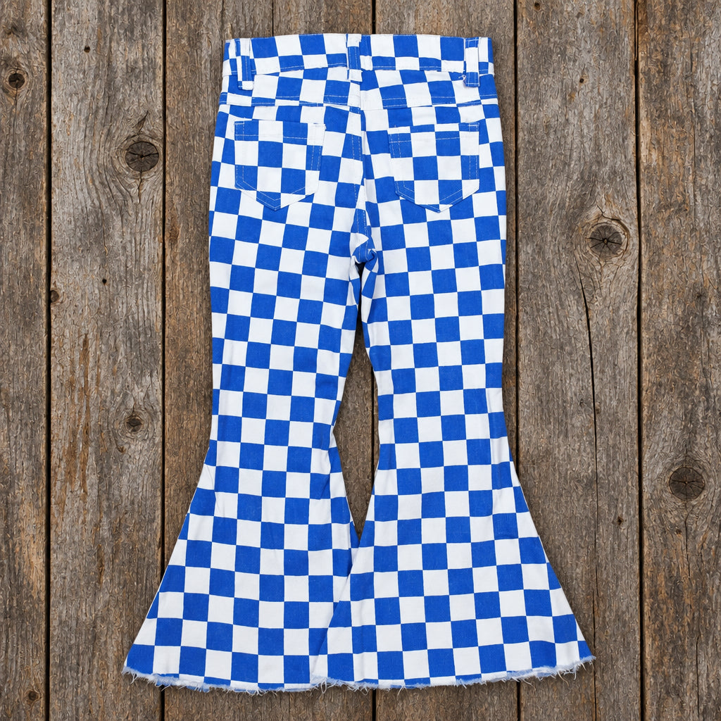 back of bluechecker flare jeans for girls on barnwood background