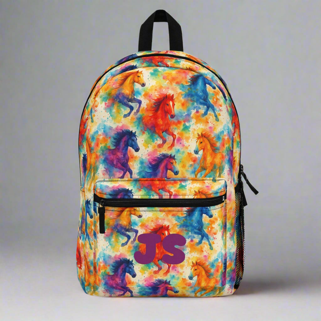 ✓ Bold allover watercolor horse pattern
✓ Custom name or initials on the front pocket
✓ Spacious design fits books, tablets & more
✓ Padded straps & back for comfy wear
✓ Side mesh pockets & front zip pocket for essentials
✓ FREE Shipping in the USA! 🚚 Please allow 5 days for production plus shipping.
