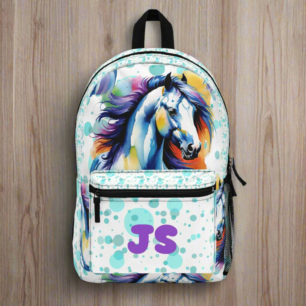 🐴✨ Saddle up for school in style with this Personalized Horse Backpack! Bursting with vibrant watercolor splashes and a bold horse graphic, this bag is perfect for your little equestrian or horse-loving kiddo. Add their name or initials to make it uniquely theirs! 🎒🌈

✓ Customizable front pocket with name or initials