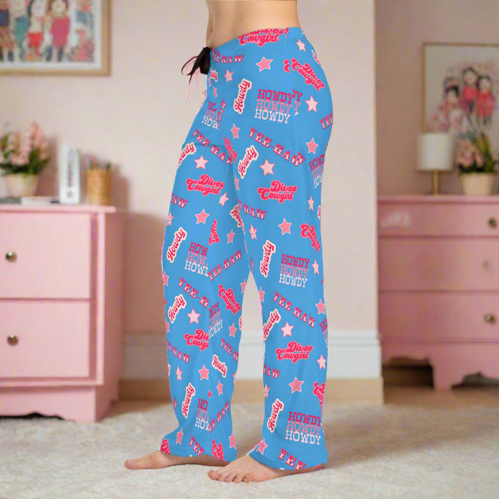 Disco Cowgirl Pajama Pants – Periwinkle Yeehaw Dreams 💫🤠

Bring the party to your pajamas! These periwinkle blue lounge pants are covered in playful phrases like "Disco Cowgirl," "Howdy," "Yee Haw," and sprinkled with stars for that extra Western sparkle. Whether you're chilling at home or planning the cutest cowgirl-themed sleepover, these fun PJs bring bold cowgirl energy to every moment.

Perfect for bachelorette weekends, birthday surprises, or cozy nights in with your boots off and your sass on. Thes