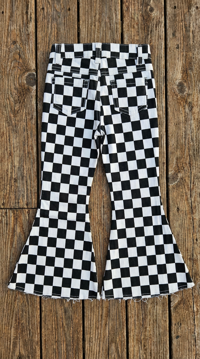 flay lay back view of checkerboard pants against barnwood background