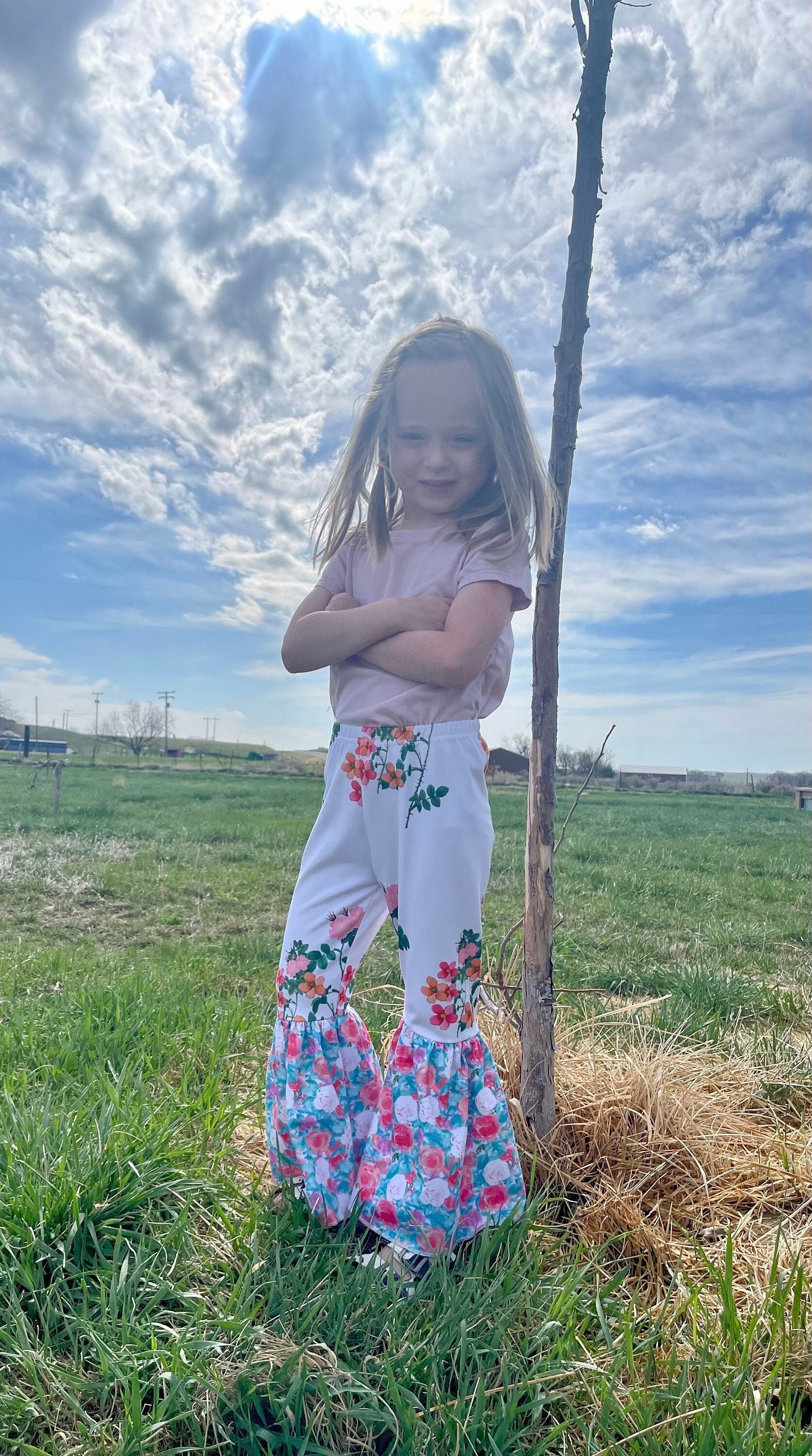 Floral Bell Bottoms designed with vibrant flower patterns and fun, playful colors are made with high-quality materials that promise comfort and durability, ensuring they’ll be a favorite all season long. These Wildflower pants will not disappoint!