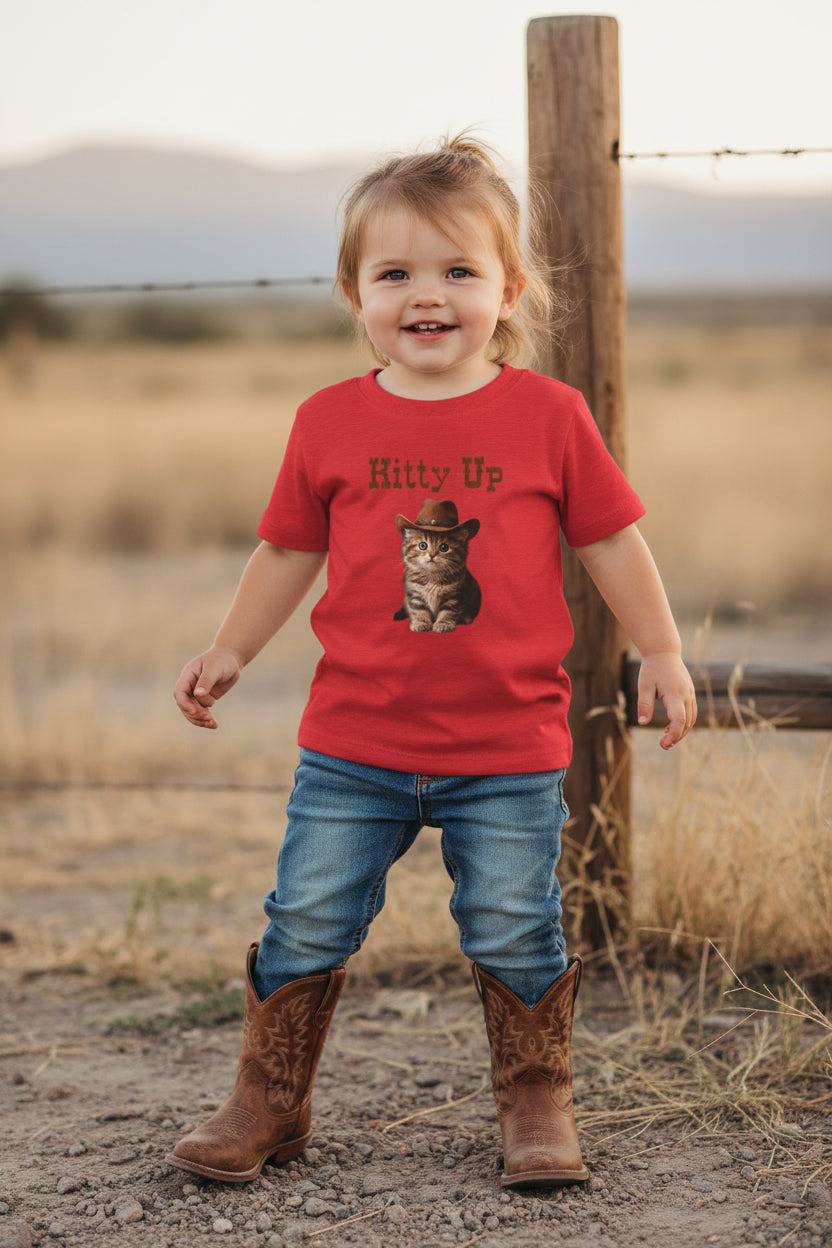 toddler girl wearing a Red t-shirt with a kitten wearing a cowboy hat and 'Kitty Up'