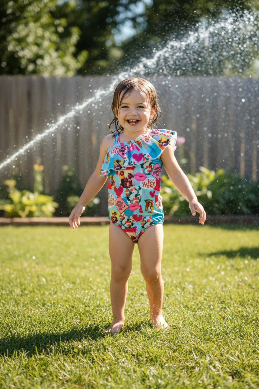 Yeehaw, Cowgirl Cutie! 🤠💗 This fun and fabulous Western Ruffled Swimsuit is perfect for little cowgirls who love adventure! Featuring a darling print of cowgirls riding horses, hearts, and cacti, this one-piece swimsuit is as cute as it gets. ✨ Why You’ll Love It: ✔️ Available in sizes 0-3 months to 8/9 – perfect for babies, toddlers, and big sisters! ✔️ Double-layered front for comfort and durability. ✔️ High-quality swimsuit material that’s made to last. 📦 FREE U.S. shipping on orders $35+